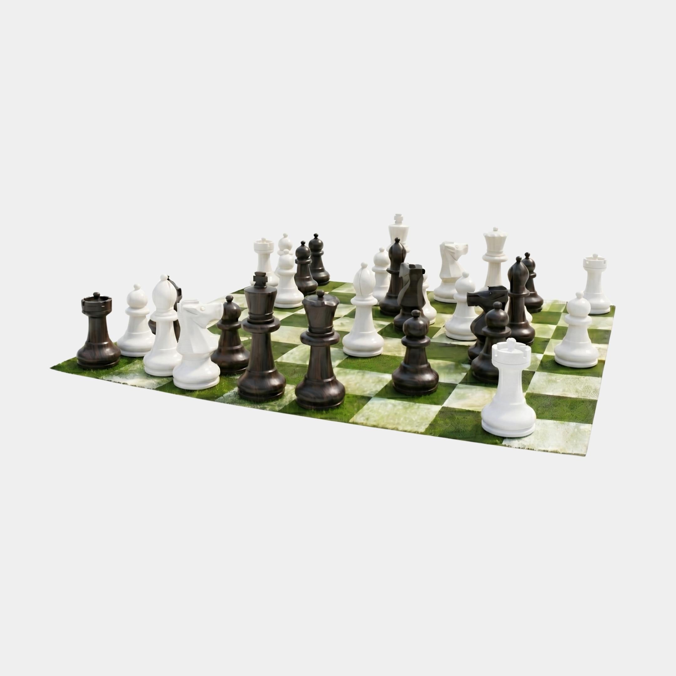 Giant Sculptures 40cm black and white marble chess set arranged mid-game on a green and white checkered board against a plain light background.