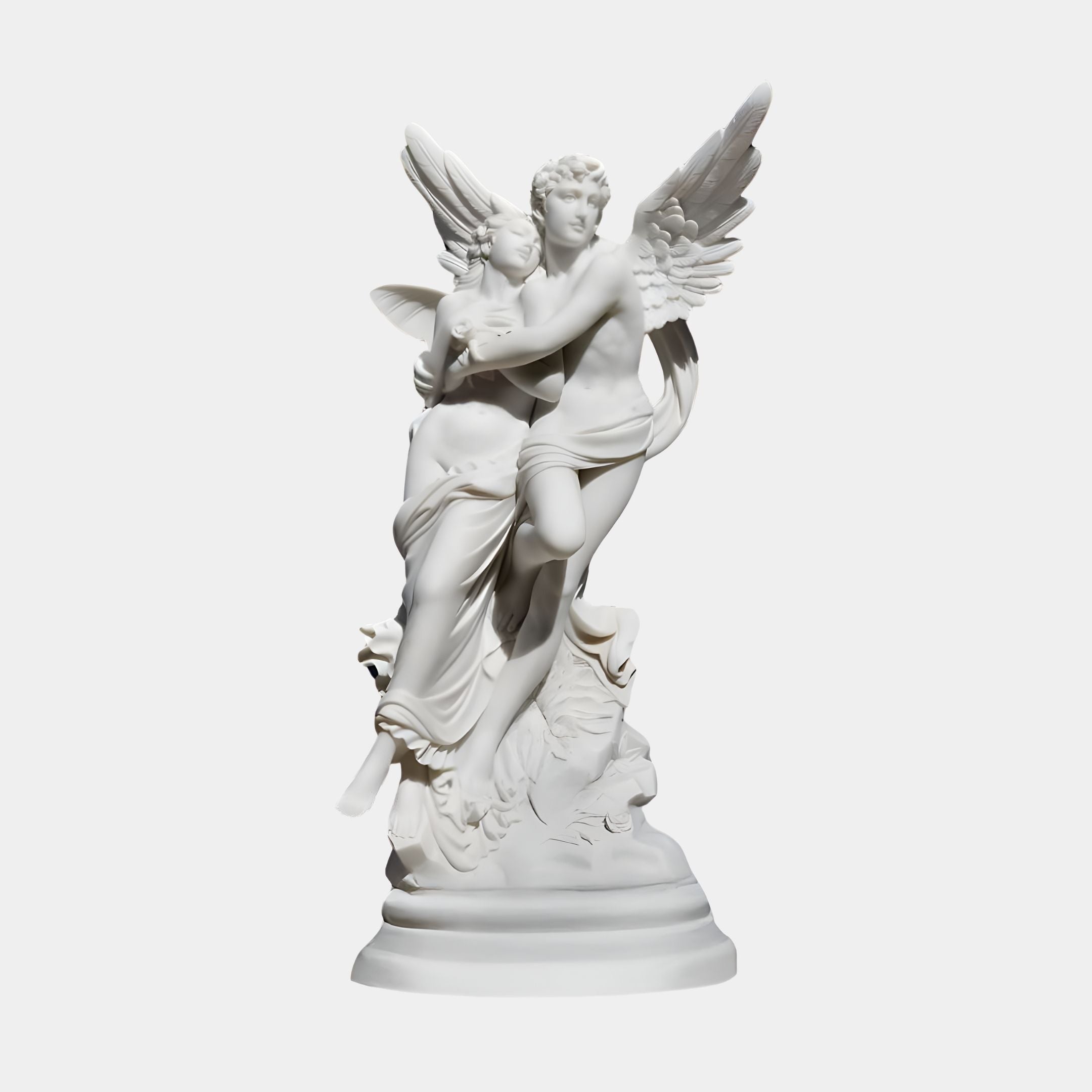 The Angelic Embrace Marble Outdoor Sculpture by Giant Sculptures features a winged male embracing a female on a stone-like base, exuding grace and movement as the figures lean forward slightly. Height: 260cm.