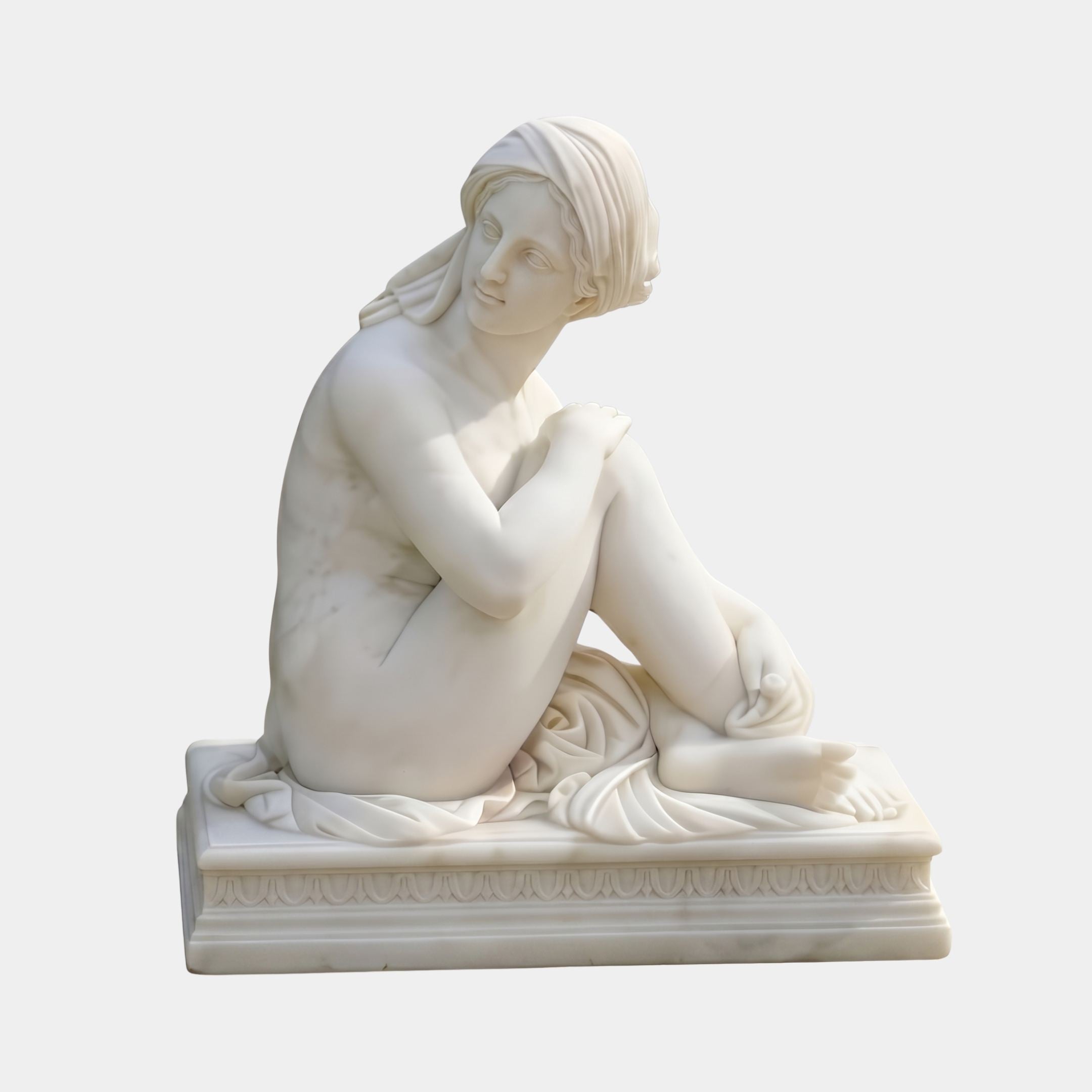 Seated Bathing Woman Marble Sculpture 80cm by Giant Sculptures, a white marble figure with head wrap, knees drawn up and drapery pooling on a moulded base.