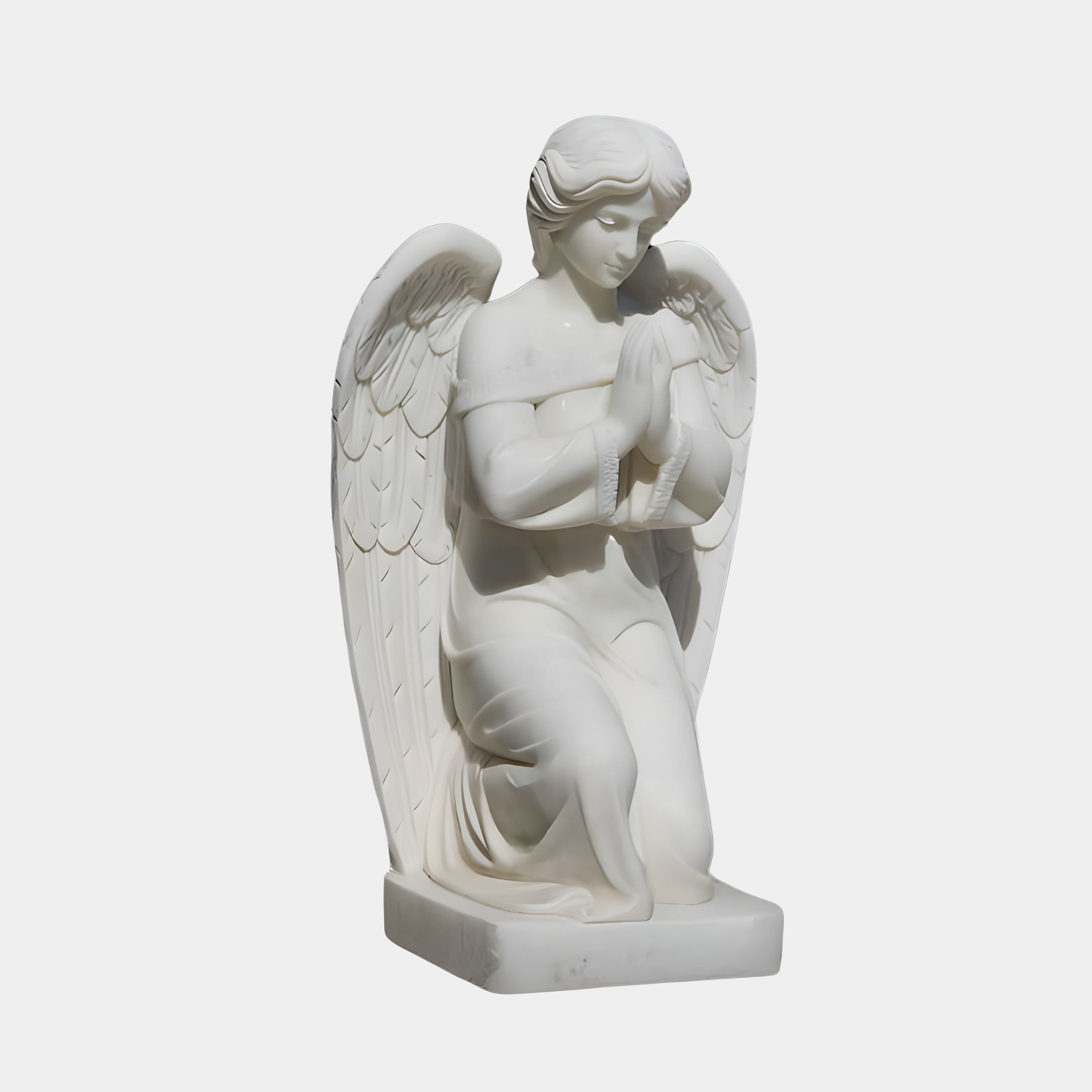 The Kneeling Prayer Angel Marble Outdoor Sculpture by Giant Sculptures features a serene, detailed angel kneeling with clasped hands and intricately crafted wings, standing 120cm tall against a plain background.