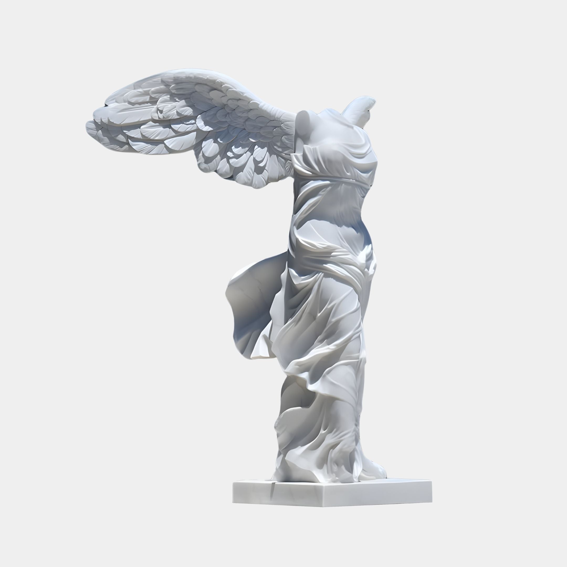 The Flowing Winged Victory Marble Outdoor Sculpture - 190cm by Giant Sculptures, a masterpiece of Classical Art, stands headless and armless. Its large wings and flowing robes suggest movement and triumph on its rectangular base.