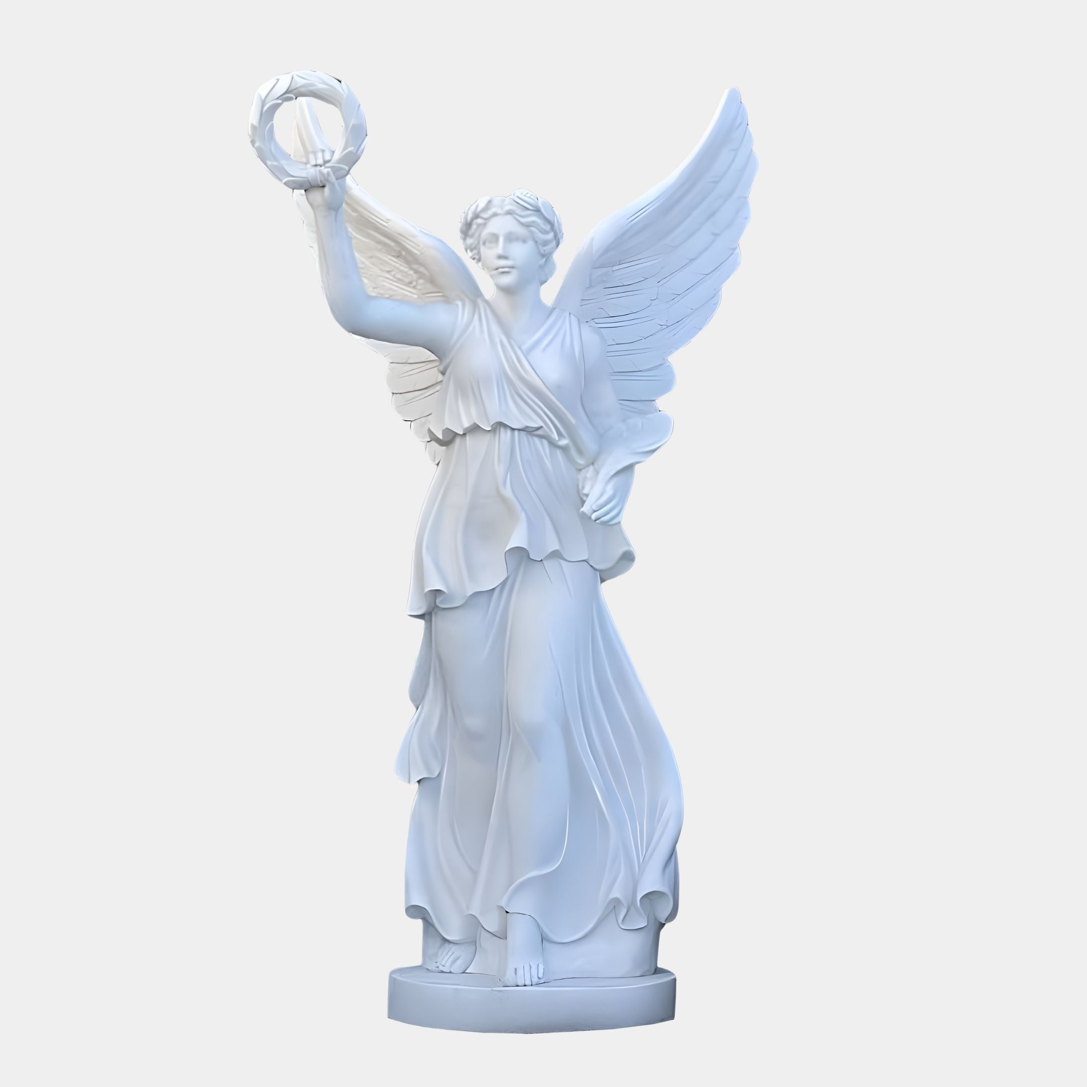 The Victory Wreath Angel Marble Outdoor Sculpture by Giant Sculptures beautifully conveys serenity, featuring a winged angelic figure in white marble. At 220cm, it displays flowing robes and a raised wreath, with expansive wings as she stands elegantly on a round pedestal.