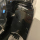 Close-up of the Black Stone Bear Sculpture by Giant Sculptures, showing the glossy black resin surface with hand-applied silver and grey paint splashes.