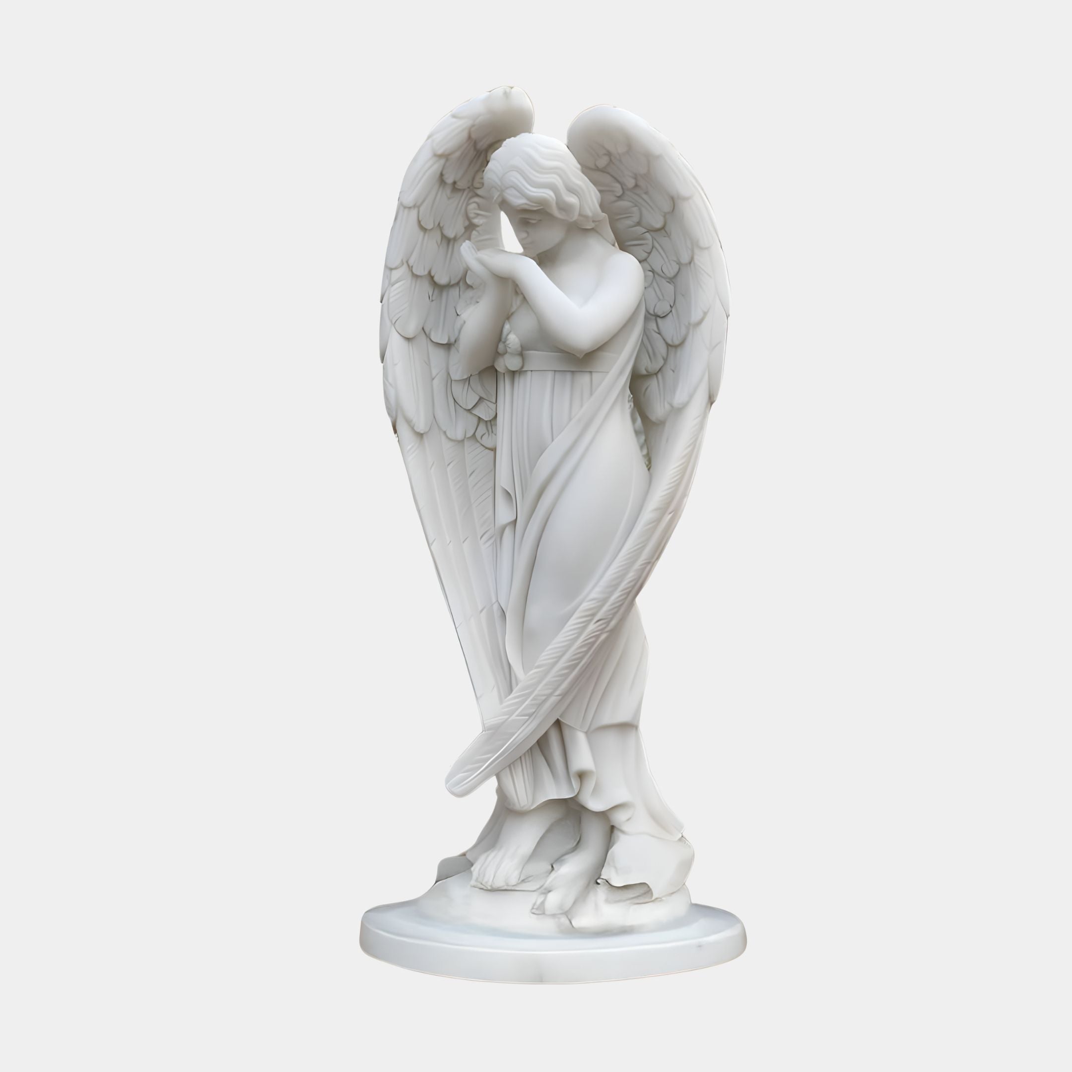 The Whispering Wings Angel Marble Outdoor Sculpture by Giant Sculptures features a serene angel with detailed wings, standing gracefully with hands pressed together near the face in contemplation, draped in flowing robes, on a smooth circular base. (80cm).