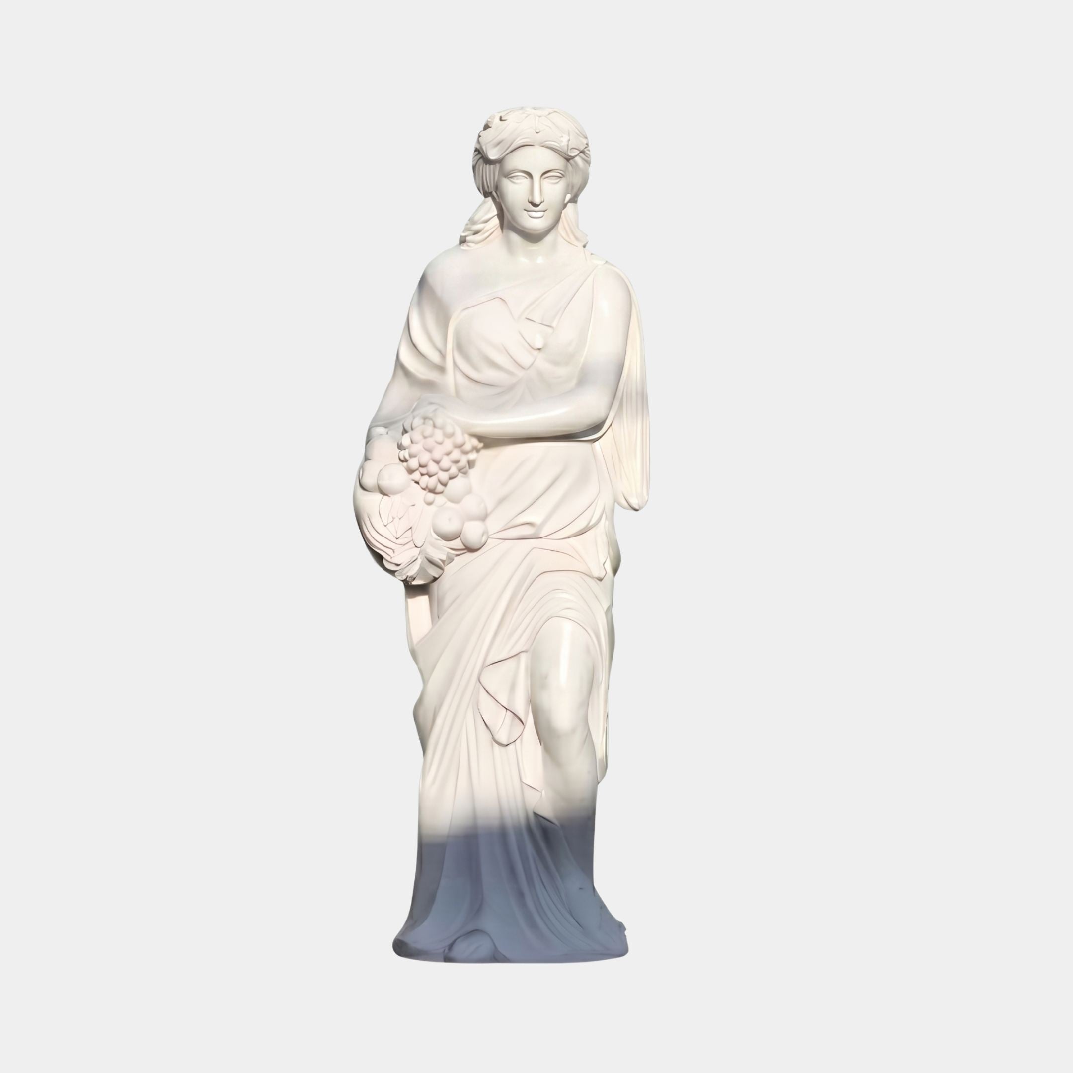 Spring Maiden Marble Sculpture by Giant Sculptures, 160cm white marble figure in flowing robes holding a cluster of fruit and grapes, shown on a plain background.