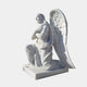 The Devout Kneeling Angel Marble Outdoor Sculpture (140cm) by Giant Sculptures features a white angel with detailed wings and folded arms on a square base, exuding serenity and tranquility in any outdoor setting with its spiritual expression and soft light.