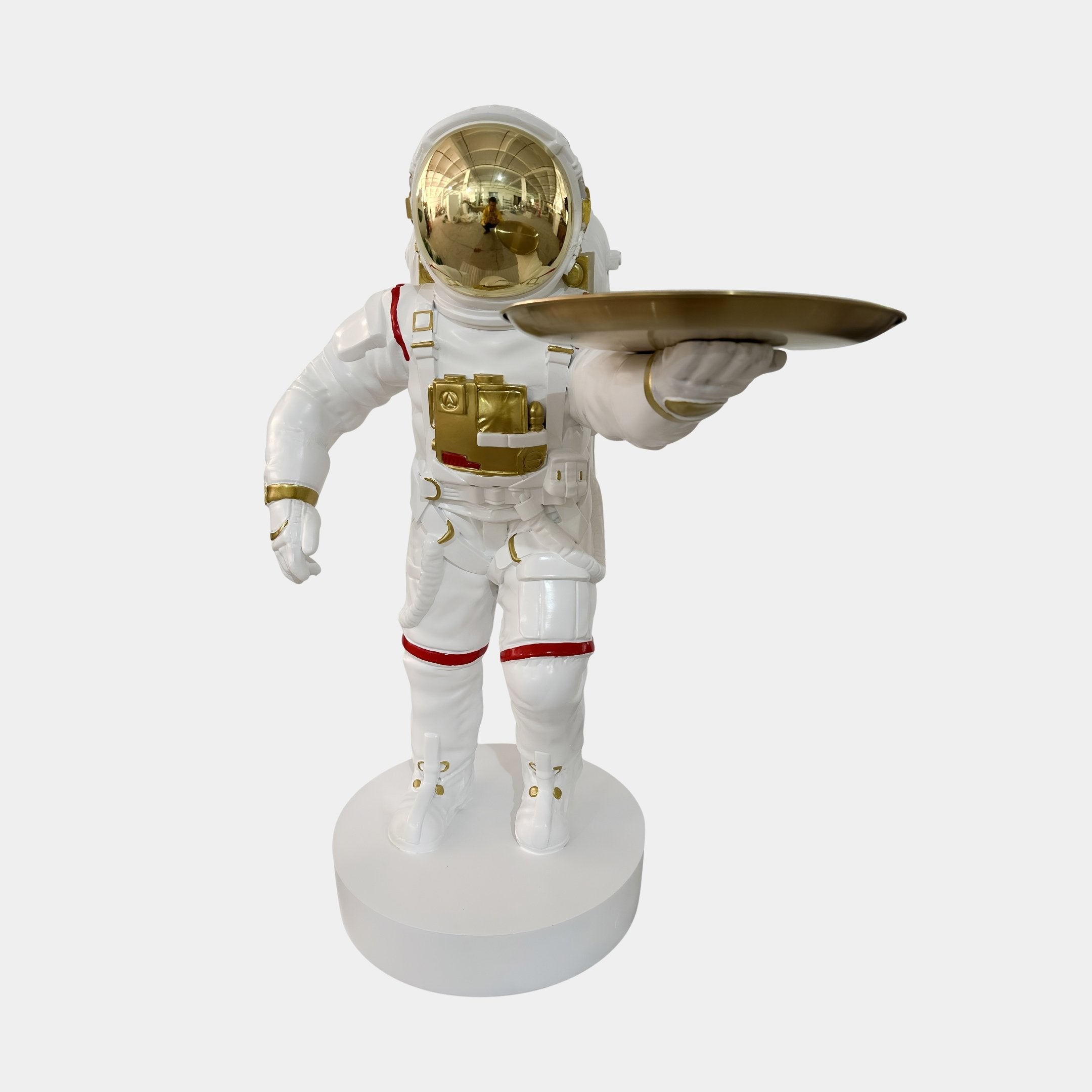 The White Space Astronaut Explorer Serve Sculpture by Giant Sculptures stands 85cm tall, featuring a white suit with gold and red accents, gold visor and tray, chest panel details, and a round white base—perfect space-themed decor.