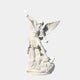 The Conquering Spear Archangel Marble Outdoor Sculpture by Giant Sculptures features a majestic archangel, expertly crafted in marble, triumphantly wielding a spear over a defeated foe on a rocky base.