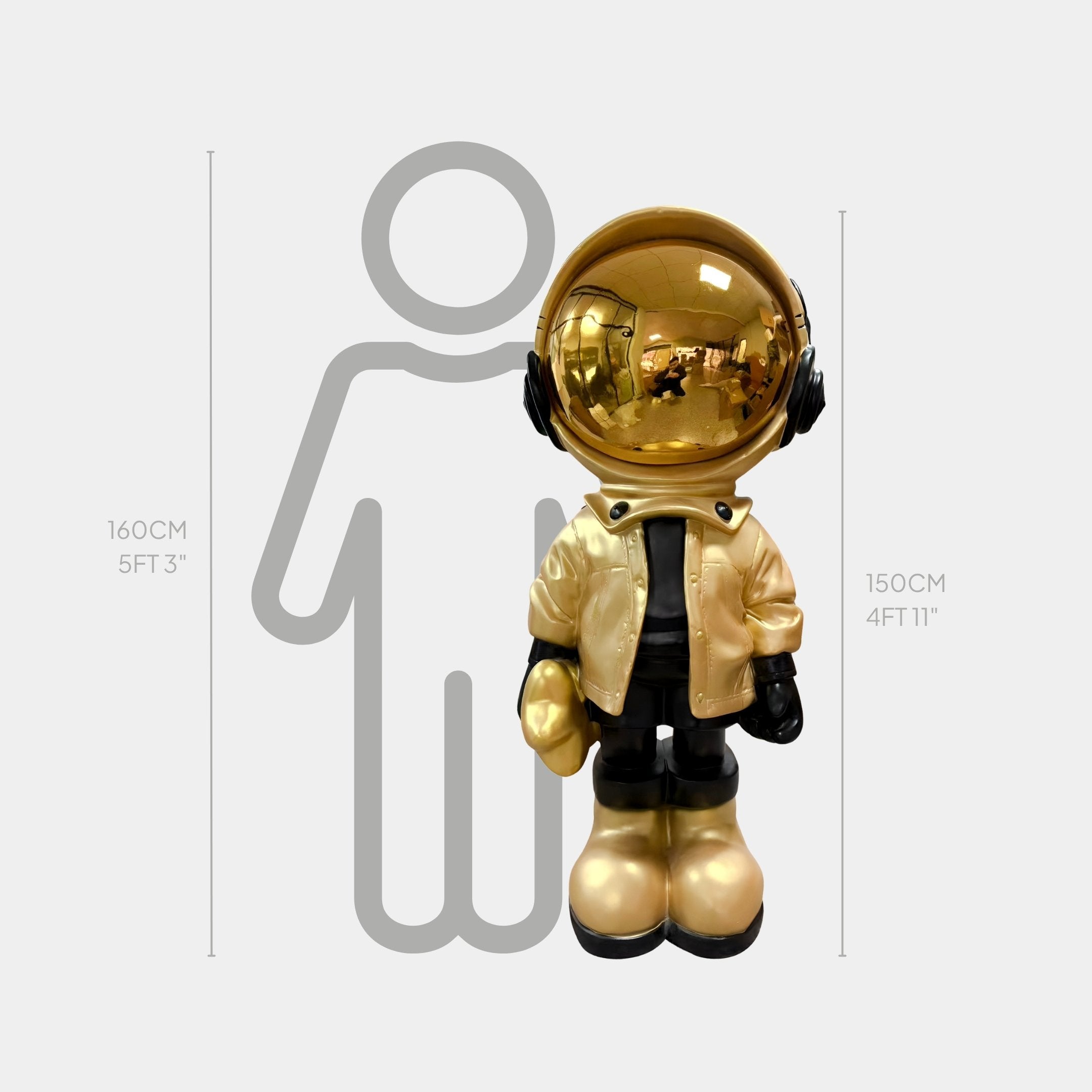 The Celestial Gold Astronaut Beats Sculpture by Giant Sculptures stands life-size at 150cm (4 ft 11 in) before a height chart, next to a gray outline of a person marked at 160cm (5 ft 3 in).