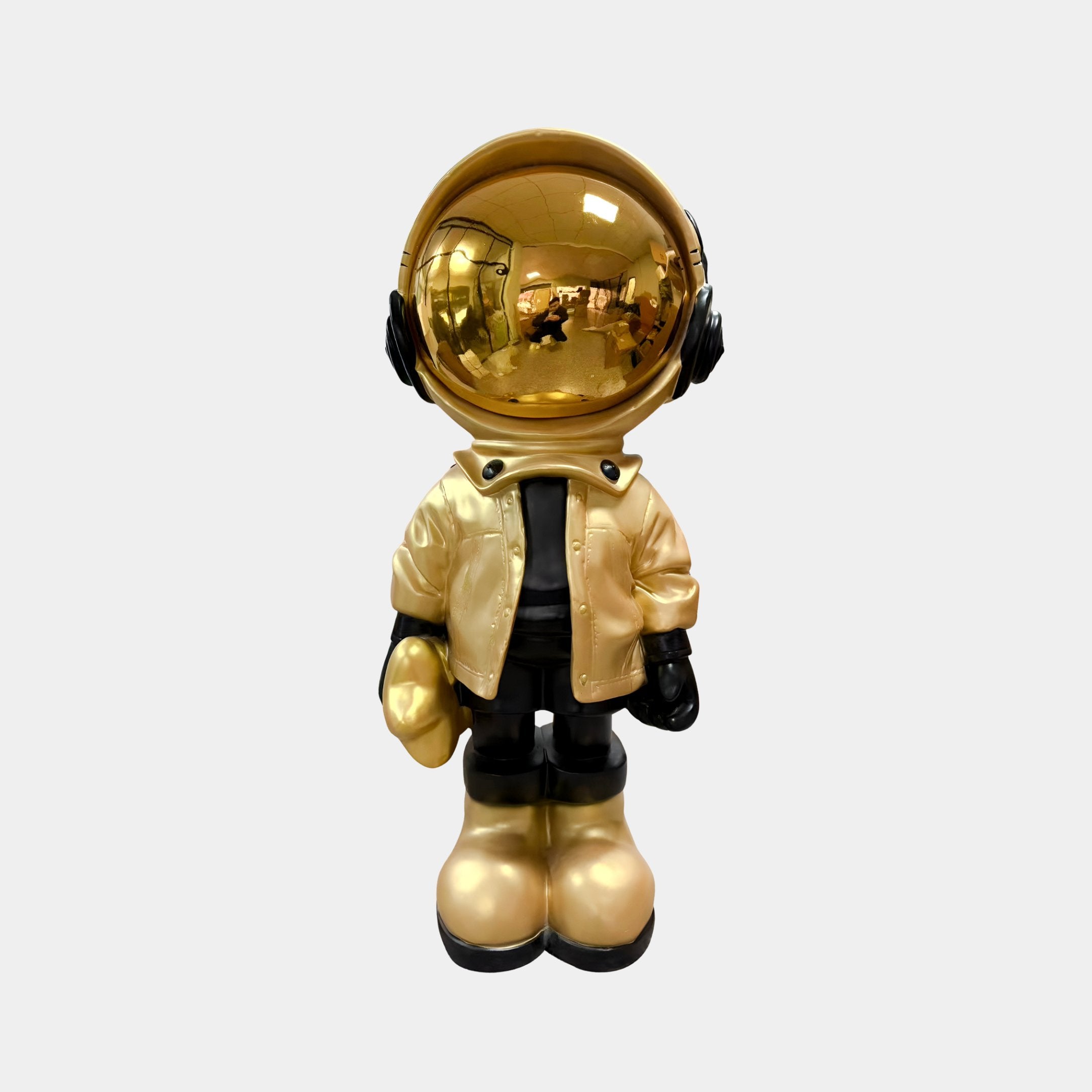 The Celestial Gold Astronaut Beats Figure (36cm) by Giant Sculptures features a shiny gold helmet, visor, gloves, and boots with a gold jacket over black attire—ideal for space-themed décor on any white background.