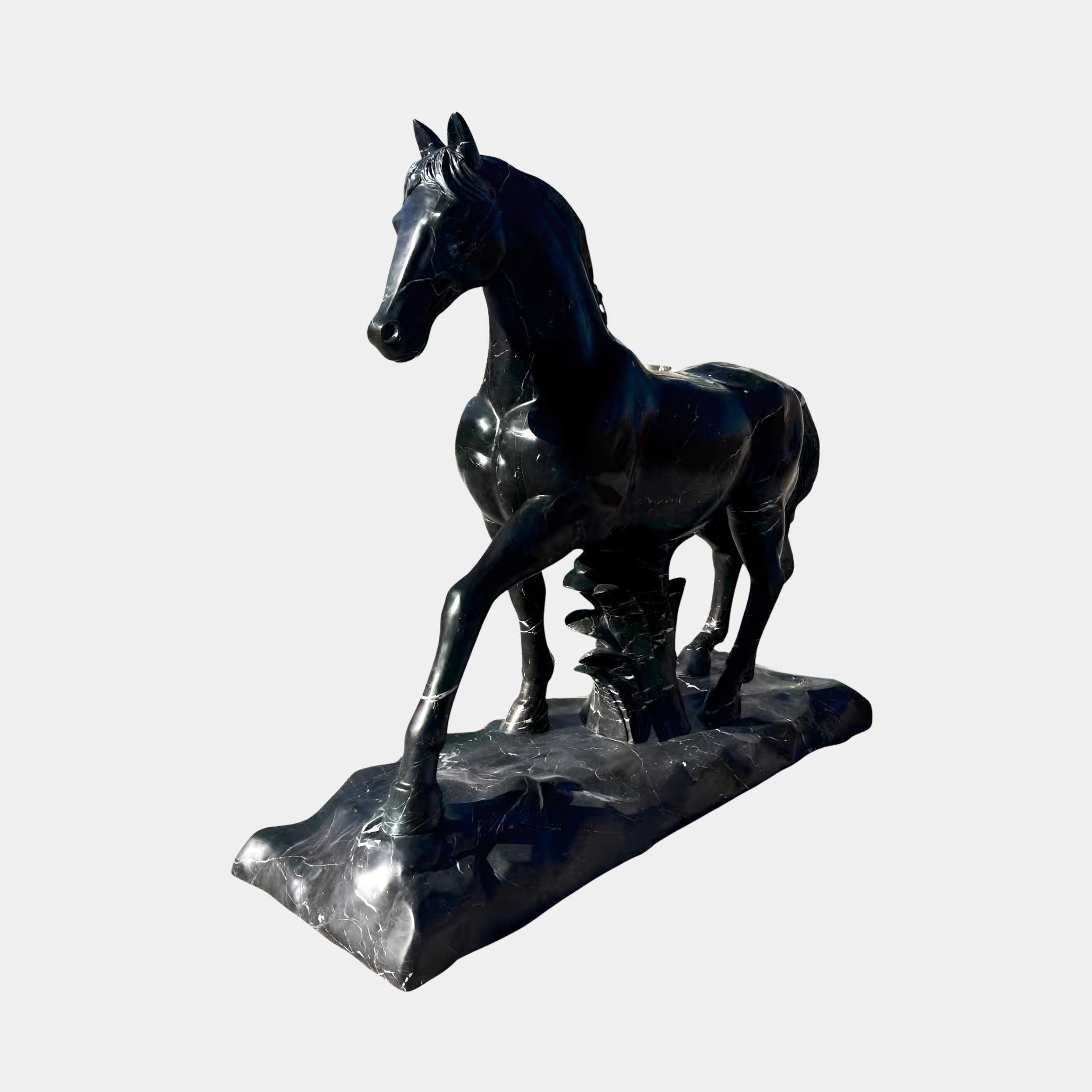 The Majestic Horse Black Marble Outdoor Sculpture by Giant Sculptures stands 220cm tall, featuring a shiny black horse with a raised front leg and turned head, displayed on a sculpted base against a plain light background.