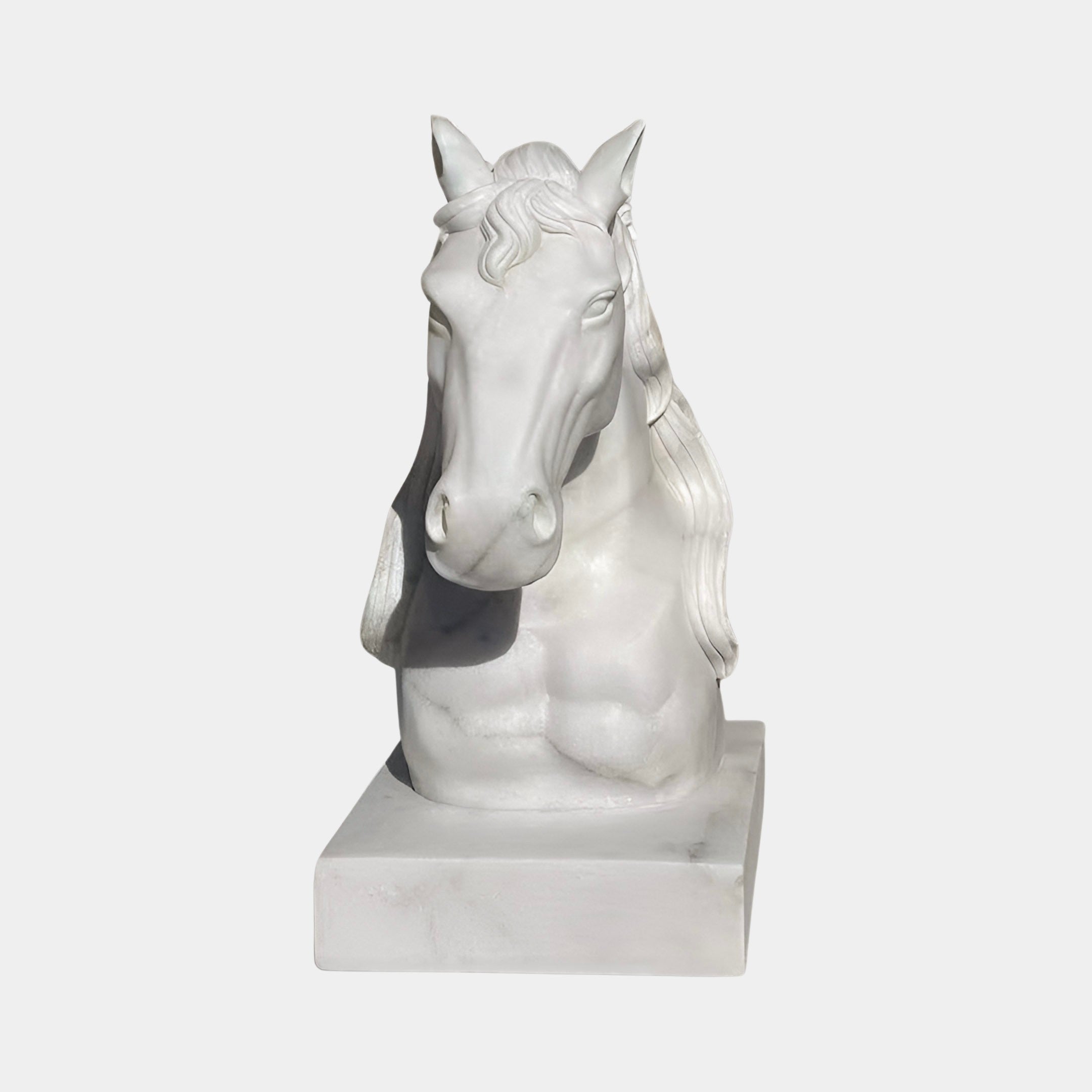 The Graceful Horse Head White Marble Outdoor Sculpture (60cm) by Giant Sculptures features a flowing mane and strong neck on a rectangular base, making it an elegant equestrian accent for any space.