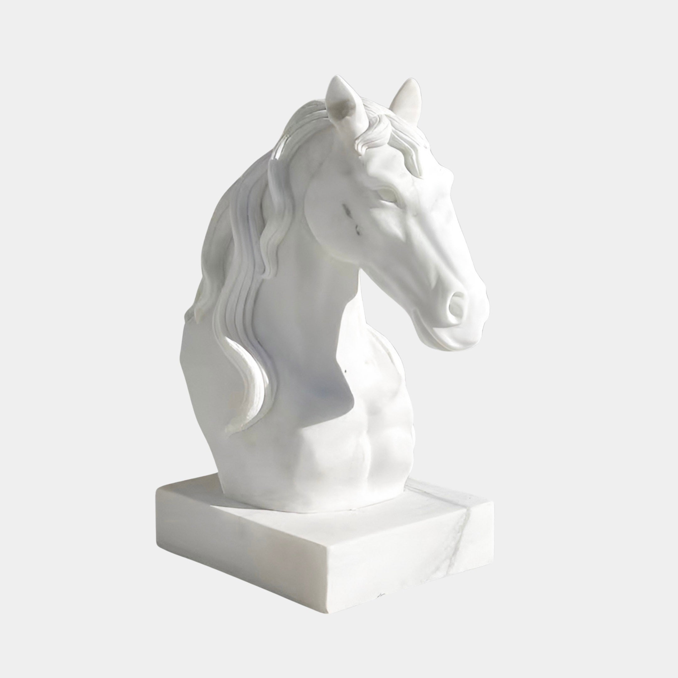 The Graceful Horse Head White Marble Outdoor Sculpture (60cm) by Giant Sculptures features lifelike details and a flowing mane, elegantly crafted in white marble and displayed on a rectangular base. Perfect as an elegant accent for any setting.