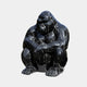 The Midnight Seated Gorilla Marble Outdoor Sculpture by Giant Sculptures features a gorilla in a pensive pose with crossed arms. Its polished black surface with white marbling shines captivatingly, making it an exquisite outdoor addition. Size: 60cm.