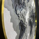 Close-up of Giant Sculptures’ Terranova Earth Green Round Wood Carving 3D Wall Art, featuring layered, textured patterns in gray, black, and white with a gold metallic rim, evoking a nature-inspired or topographic map design.