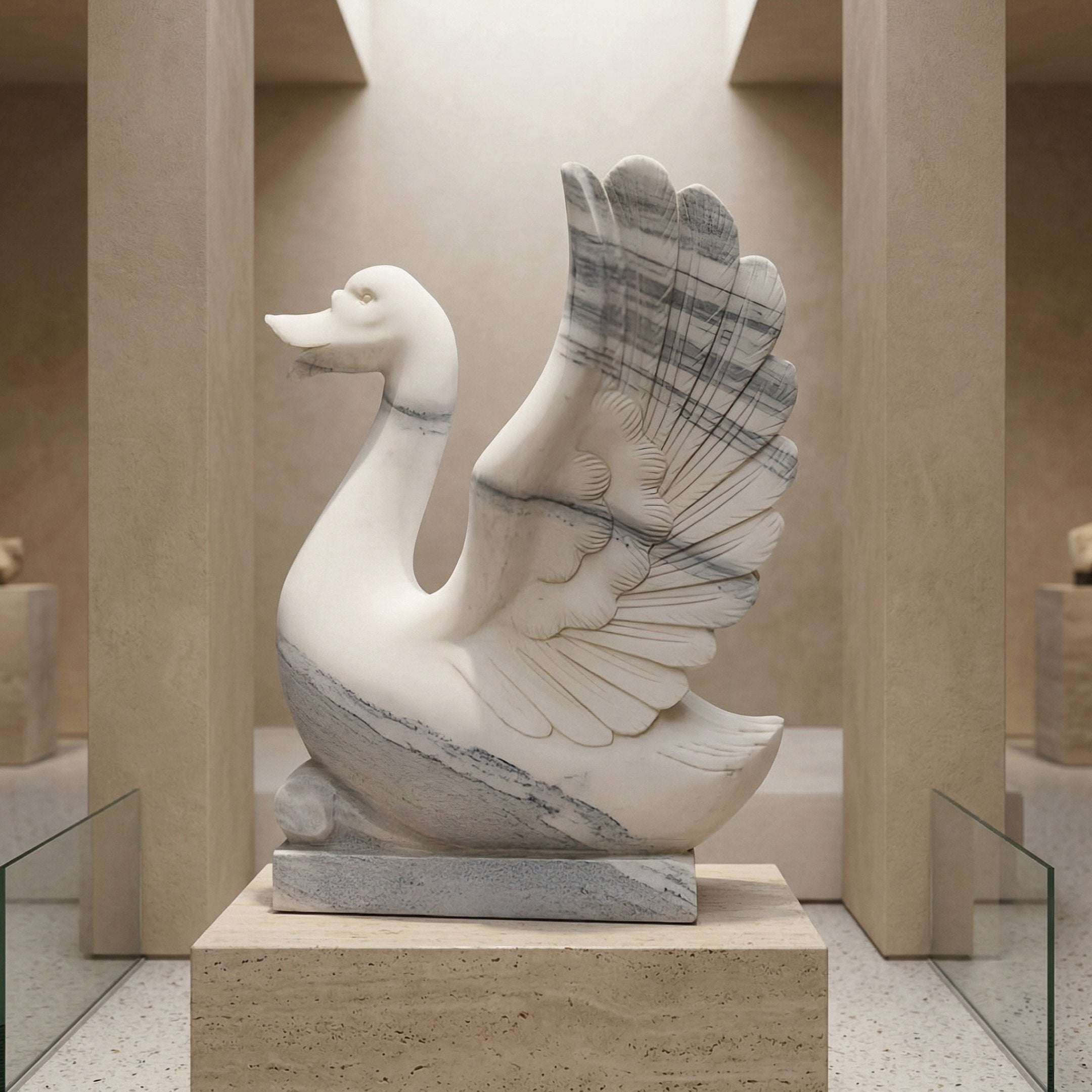 The Wings-Lifted Swan I Marble Outdoor Sculpture by Giant Sculptures, standing 120cm tall, features finely detailed feathers and graceful lines, displayed on a pedestal in a modern beige-toned gallery.