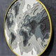 The Terranova Earth Green Round Wood Carving 3D Wall Art by Giant Sculptures features layered cutouts in earth tones with a thin gold frame, offering a striking, nature-inspired design for your wall.