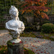 The Baroque Lady Marble Bust Sculpture by Giant Sculptures (65cm) is showcased in a serene Japanese garden with raked gravel, moss, red autumn leaves, and a colorful maple tree in the background.