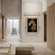 Glacia Dual Jaguar Crystal Hanging Framed Wall Art by Giant Sculptures, gold steel frame with pendulum weights, displayed in a minimalist travertine hallway.
