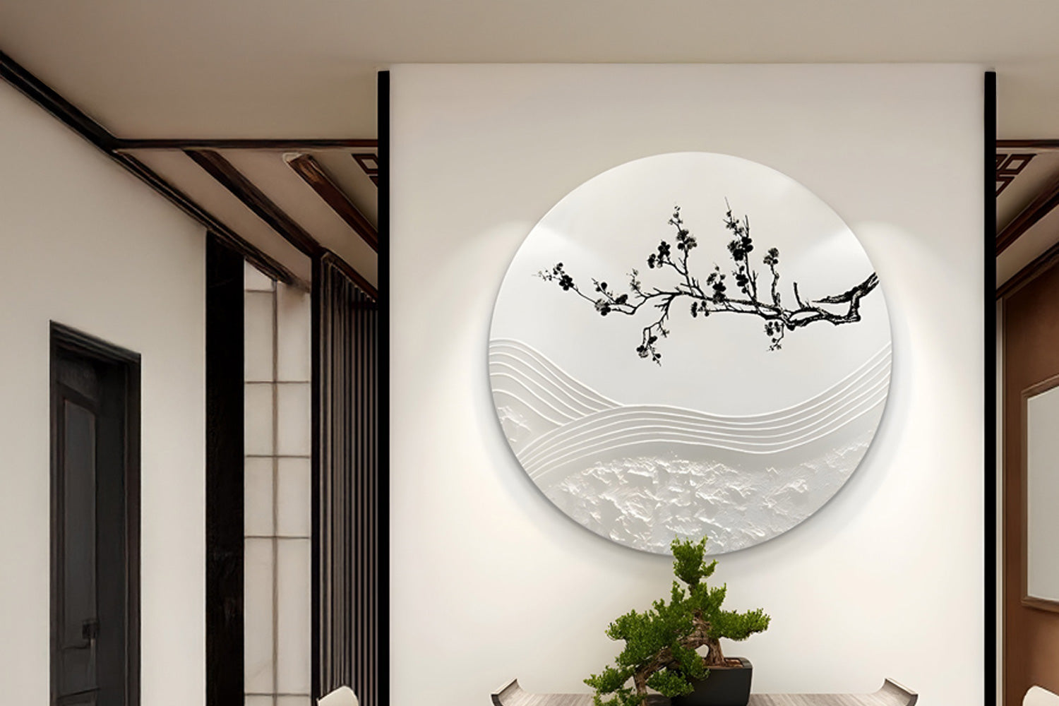 A minimalist interior features a round wall art piece with an embossed tree branch and abstract waves. Below, a small bonsai centerpiece adorns a wooden table, creating a serene and harmonious atmosphere.