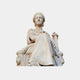 Seated Goddess Marble Sculpture 130cm by Giant Sculptures, a crowned white marble figure holding a sceptre on a lion-head throne, shown against a light grey background.