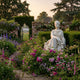 Seated Goddess Marble Sculpture by Giant Sculptures displayed in a walled English garden among pink roses, foxgloves, and lavender at dusk.