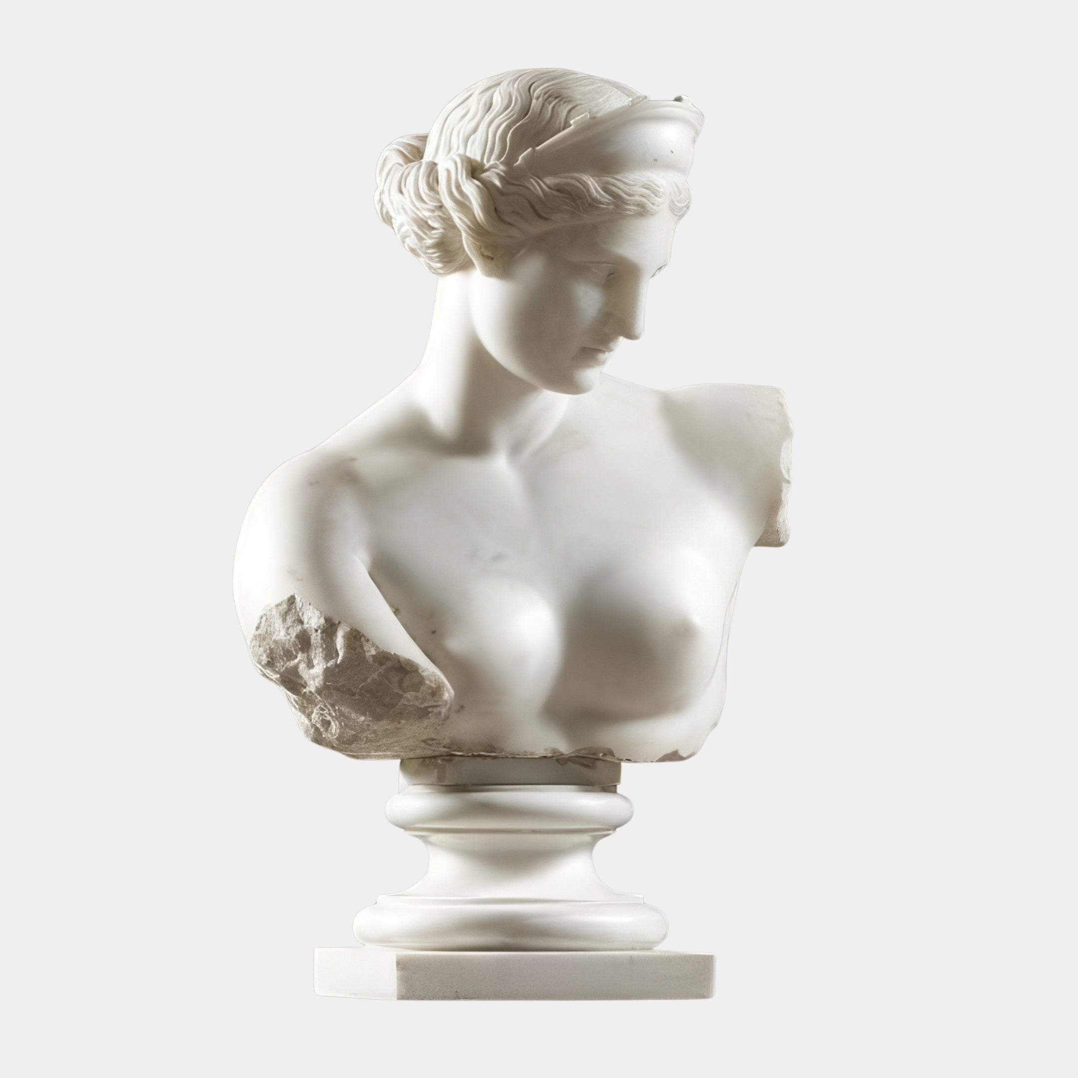 The Classical Female Marble Bust Sculpture - 75cm by Giant Sculptures features a wavy-haired woman in a headband, missing both arms with a chipped left shoulder, and is displayed on a round pedestal against a plain background.