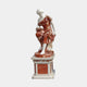 Seated Woman with Wreath Polychrome Marble Sculpture by Giant Sculptures, white figure in red-veined robes holding a wreath, on matching red and white pedestal.