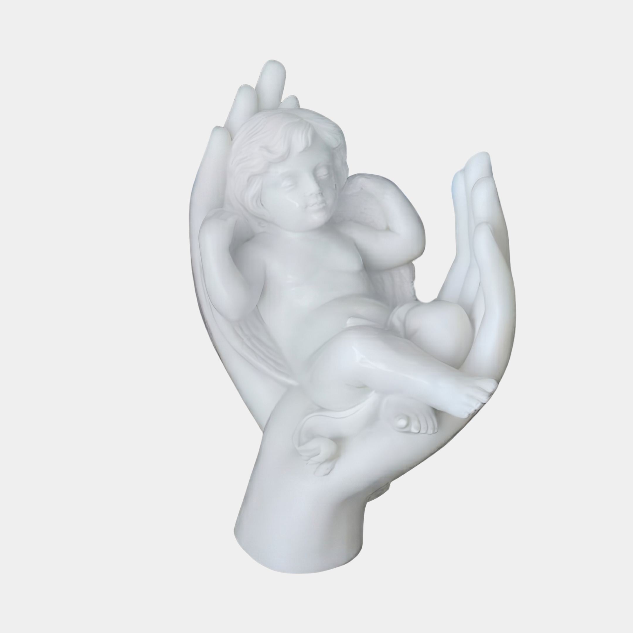 Giant Sculptures' 90cm Sleeping Child Marble Sculpture showing a winged cherub resting in a pair of cupped hands, shown against a plain light background.