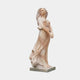 Sunset Marble Dancing Woman Sculpture 160cm by Giant Sculptures, side view of a woman in flowing draped gown with windswept hair, warm amber and pink tones.