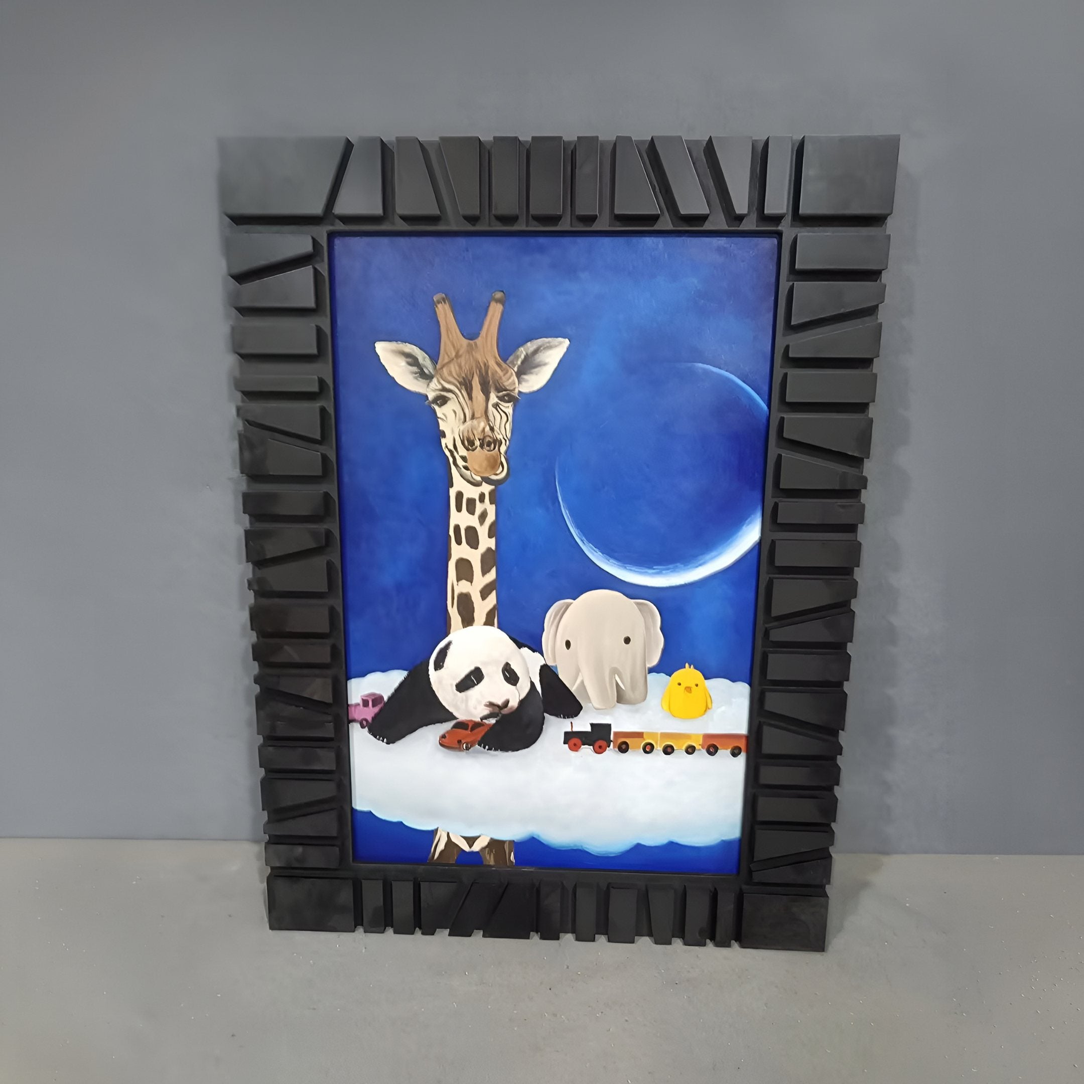 Fantoria 3-Set Animal Fantasy Oil Canvas Wall Art by Giant Sculptures features a giraffe, panda, elephant, and yellow chick on a cloud with a toy train under a blue sky and crescent moon. Black frames have geometric patterns for added charm.
