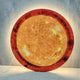 Galaxia Sun Crystal Porcelain LED Wall Art by Giant Sculptures displaying a glowing amber and golden sun surface with dark corona details, backlit LED halo visible against a light grey wall, with power cord at lower left.