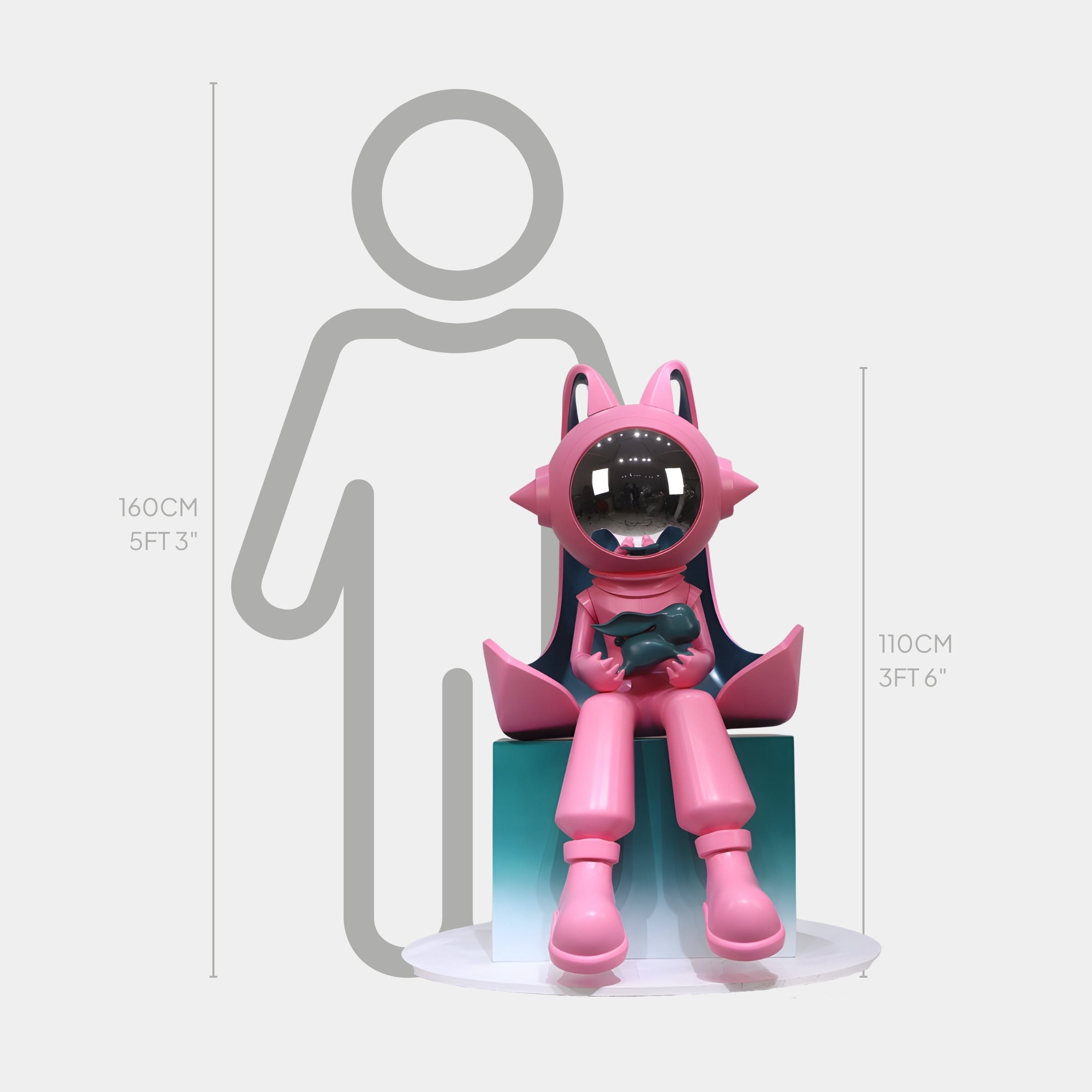 The Pink Companion Cosmo Cat Sitting Sculpture by Giant Sculptures stands 110cm tall on a blue block before a height chart, its reflective, spherical head highlighting playful cosmic charm—an eye-catching art piece for any space.