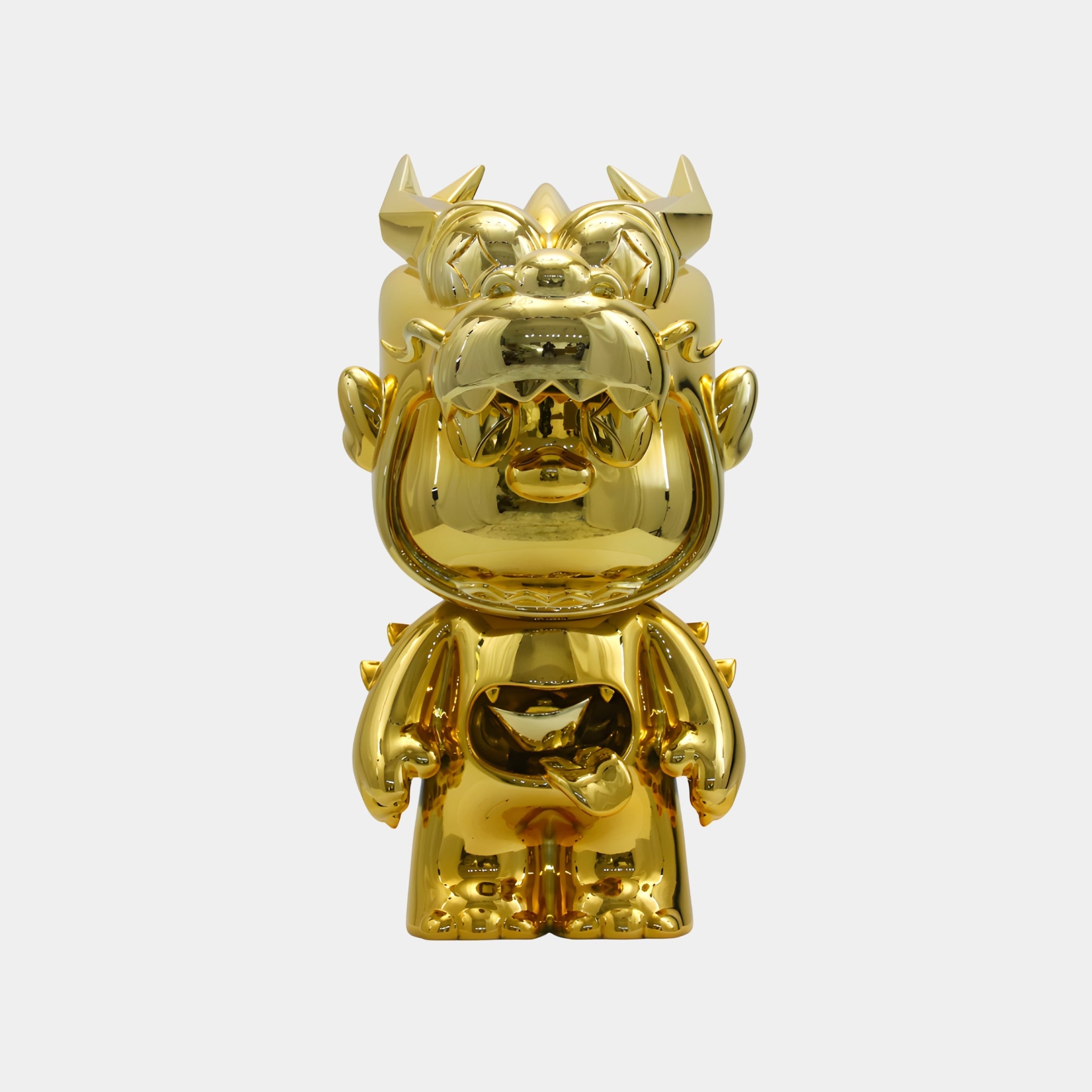 The Giant Sculptures Polished Gold Drakko Sculpture - 60cm features horns, pointy ears, and a wide open mouth, standing upright on a white background—a whimsical gold dragon and Chinese symbol of wealth.