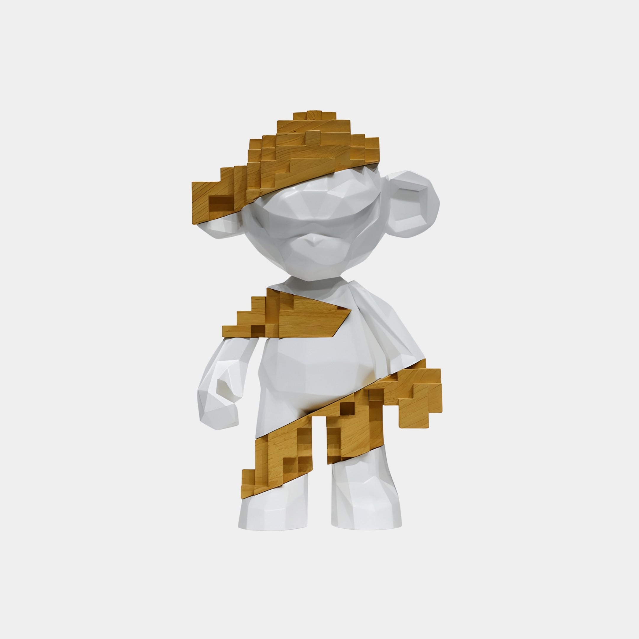 The Natural Wood & White Pixel Monkey Figure (35cm) by Giant Sculptures features a white, geometric humanoid form with pixelated brown wood accents—hat, sash, and gloves—offering nostalgic 8-bit charm against a plain backdrop.