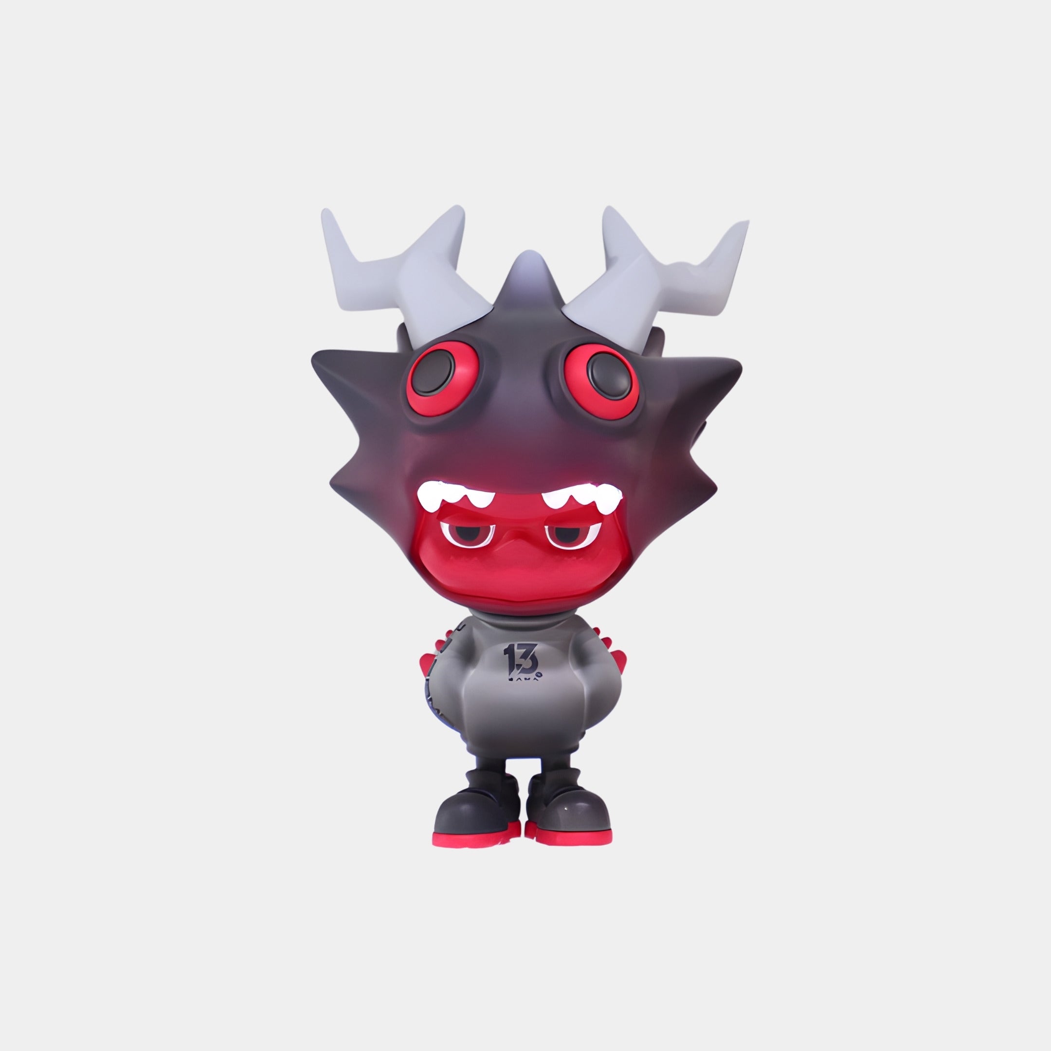 The Red & Grey Horned Drakoz Figure - 15cm by Giant Sculptures features a spiky dark head with two large white horns, red eyes, sharp teeth, a gray hoodie marked 13, black shorts, and shoes with red soles.