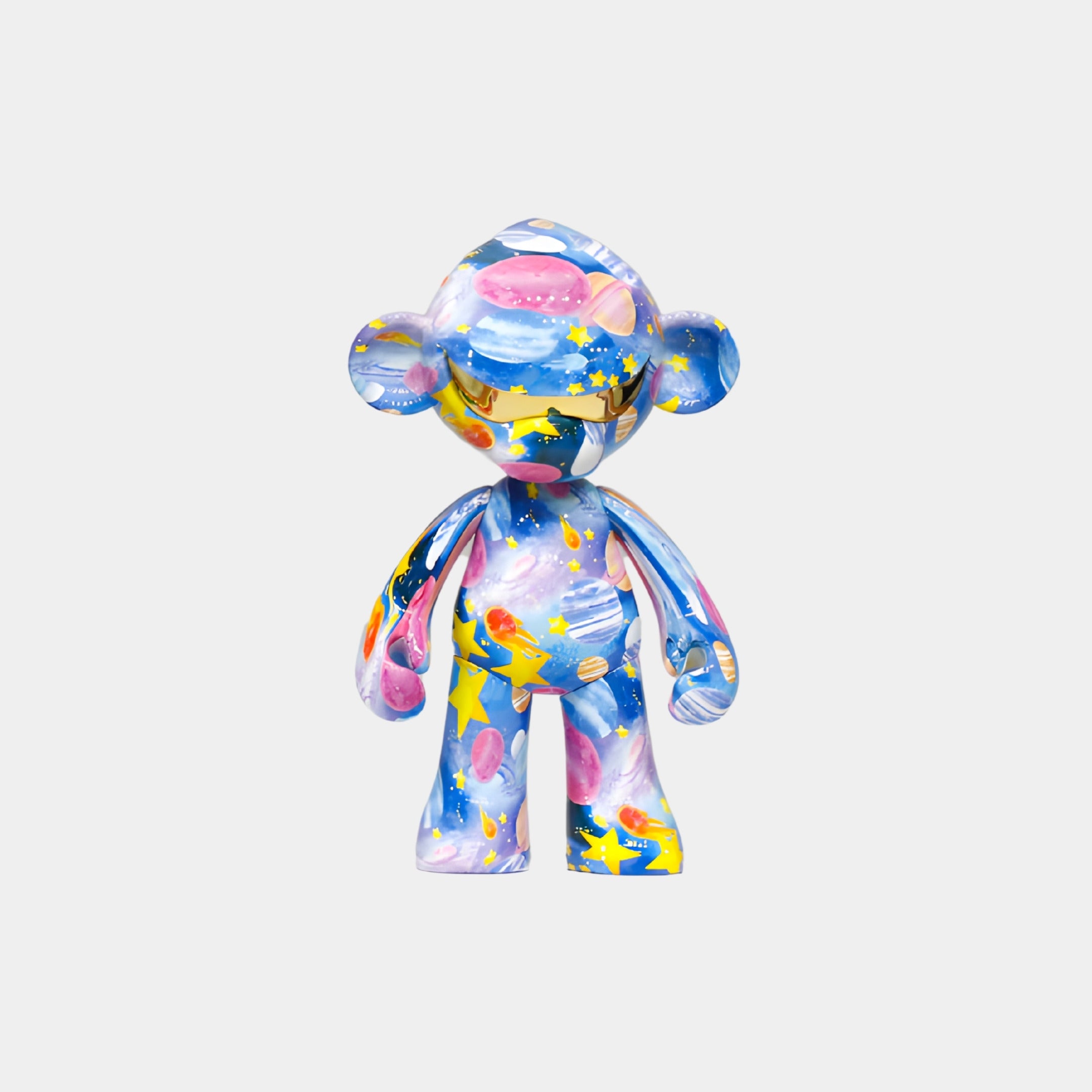 The Galaxy Orbit Monkey Figure - 35cm by Giant Sculptures features a monkey shape with a colorful space-themed design of stars, planets, and blue, pink, yellow, and white swirls on a plain white background.