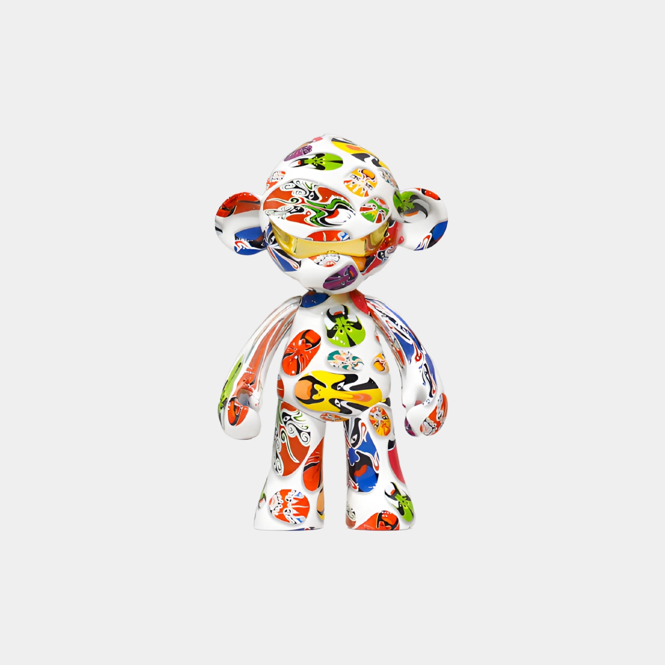 The Doodle Pop Monkey Figure - 35cm by Giant Sculptures is a glossy collectible featuring vibrant, abstract cartoon faces and patterns, making it stand out boldly against any plain white background.