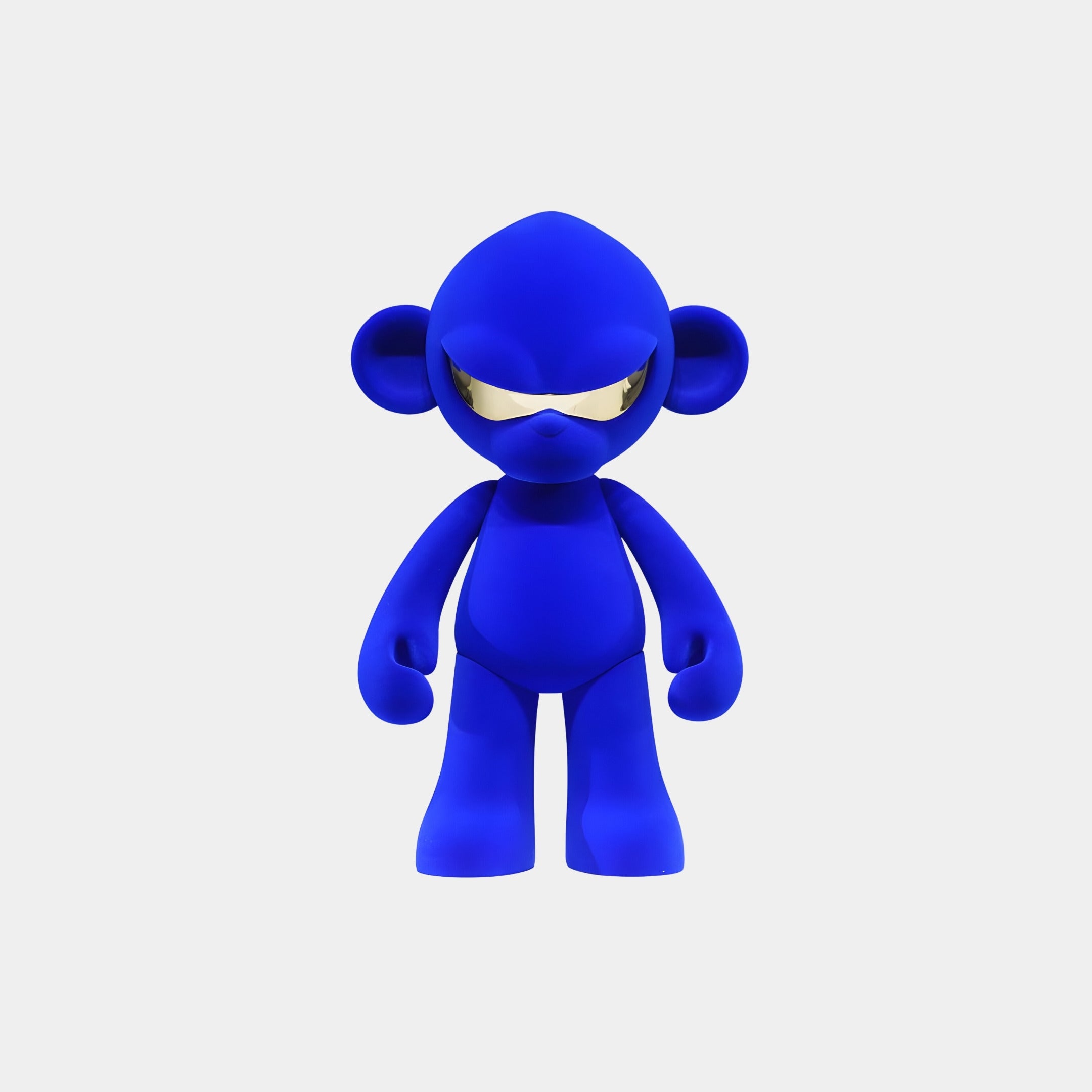 The Giant Sculptures Electric Blue Colorblock Monkey Figure (35cm) features large round ears and shiny silver sunglasses, standing forward as a premium resin collectible against a plain white background.