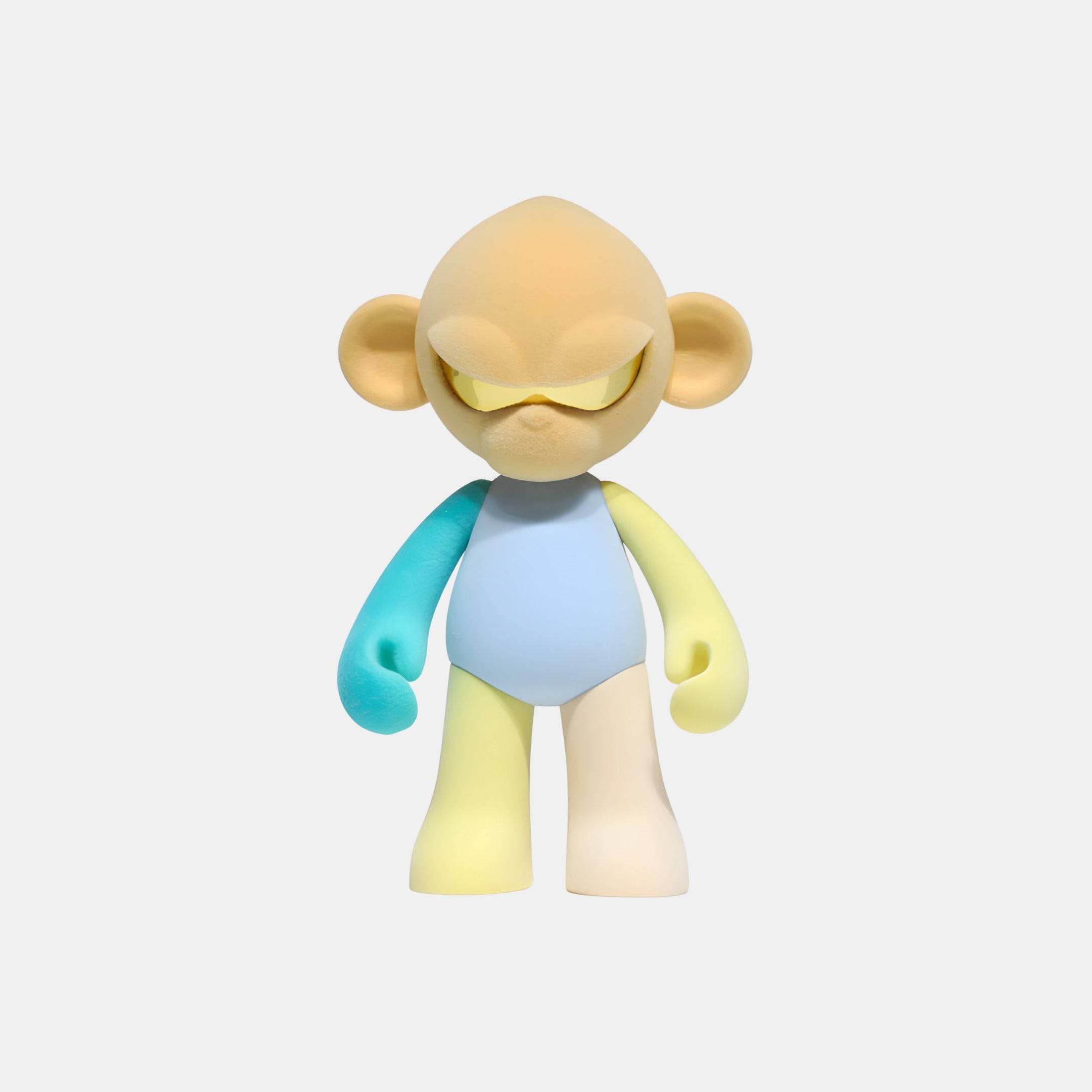The Giant Sculptures Warm Beige Head I Colorblock Monkey Figure (35cm) features a beige head, blue body, yellow left arm, aqua right arm, yellow left leg, and beige right leg—an ideal pastel collectible for warm beige decor.