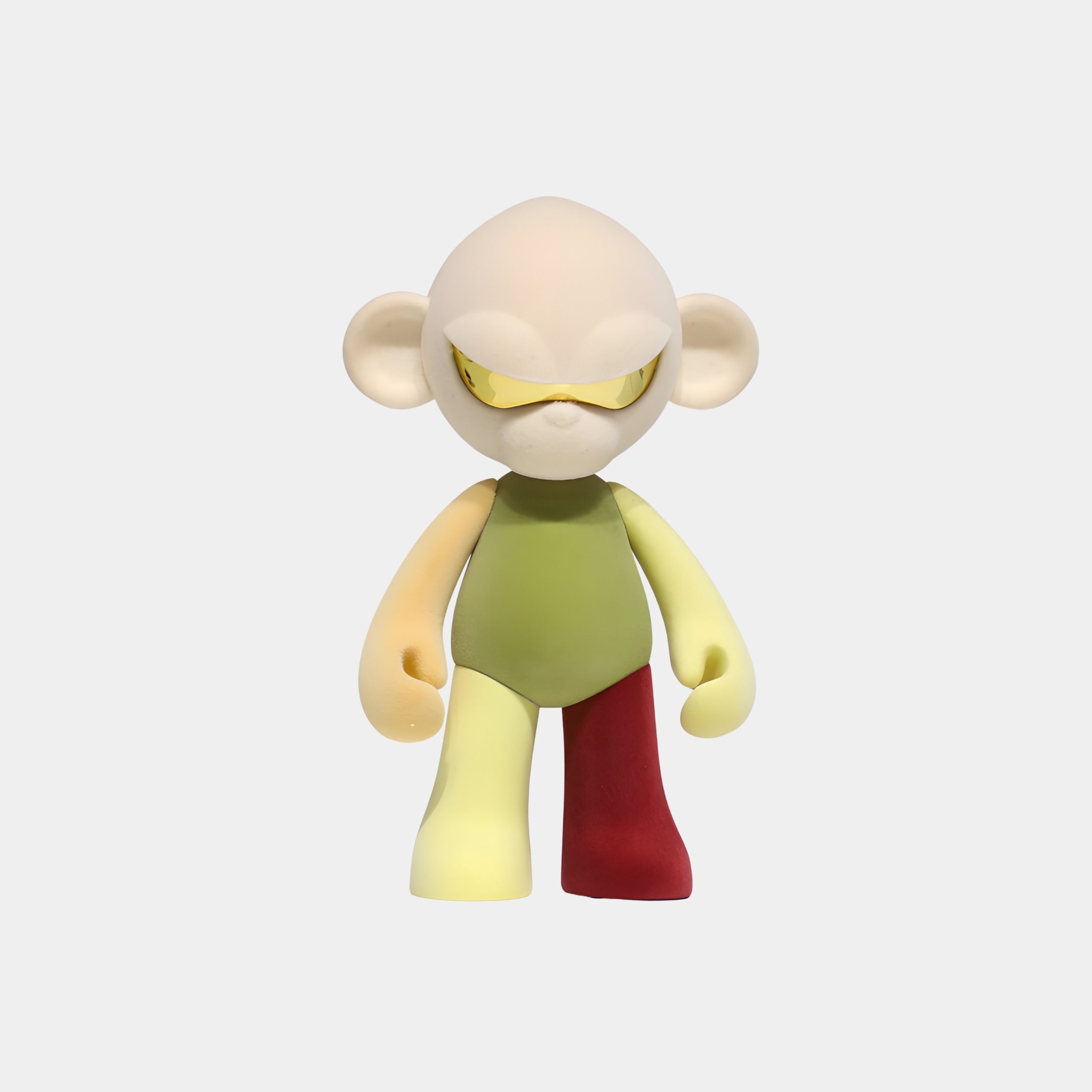 The Cream Head IV Colorblock Monkey Figure (35cm) by Giant Sculptures features a large cream head, yellow visor, and colorful limbs—perfect as a collectible sculpture for earthy home decor.
