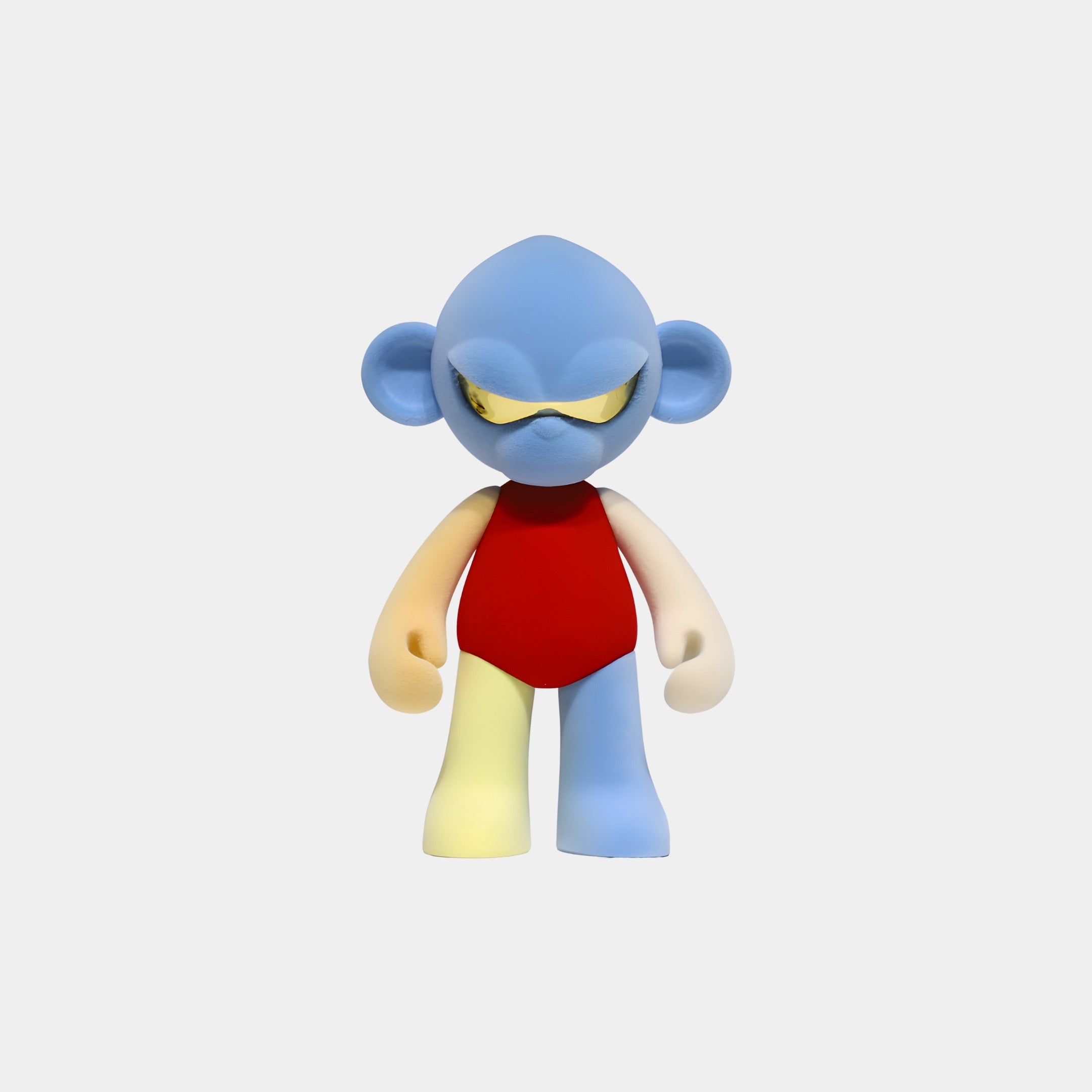 The Blue Head Colorblock Monkey Figure (15cm) by Giant Sculptures features a blue head, yellow sunglasses, red shirt, and mismatched limbs. Crafted from premium resin, it stands as a collectible sculpture on a plain white background.