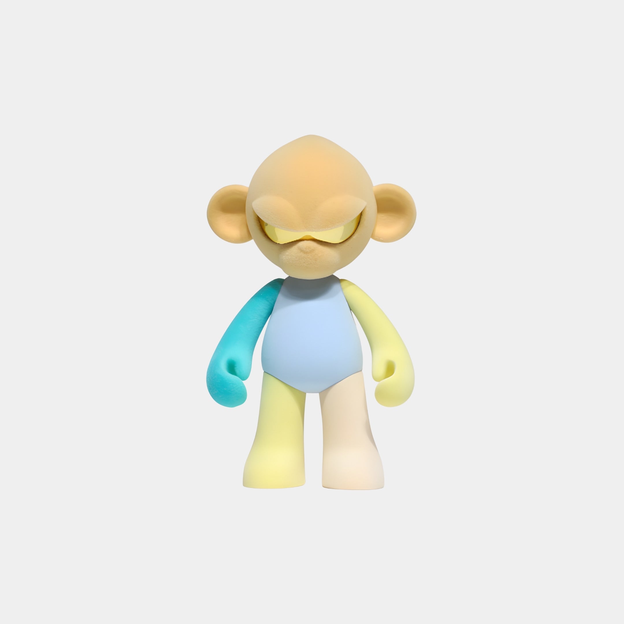 The Giant Sculptures Warm Beige Head I Colorblock Monkey Figure (15cm) features a large-headed, pastel resin design with closed eyes and multicolored limbs—an adorable collectible sculpture against a simple white background.