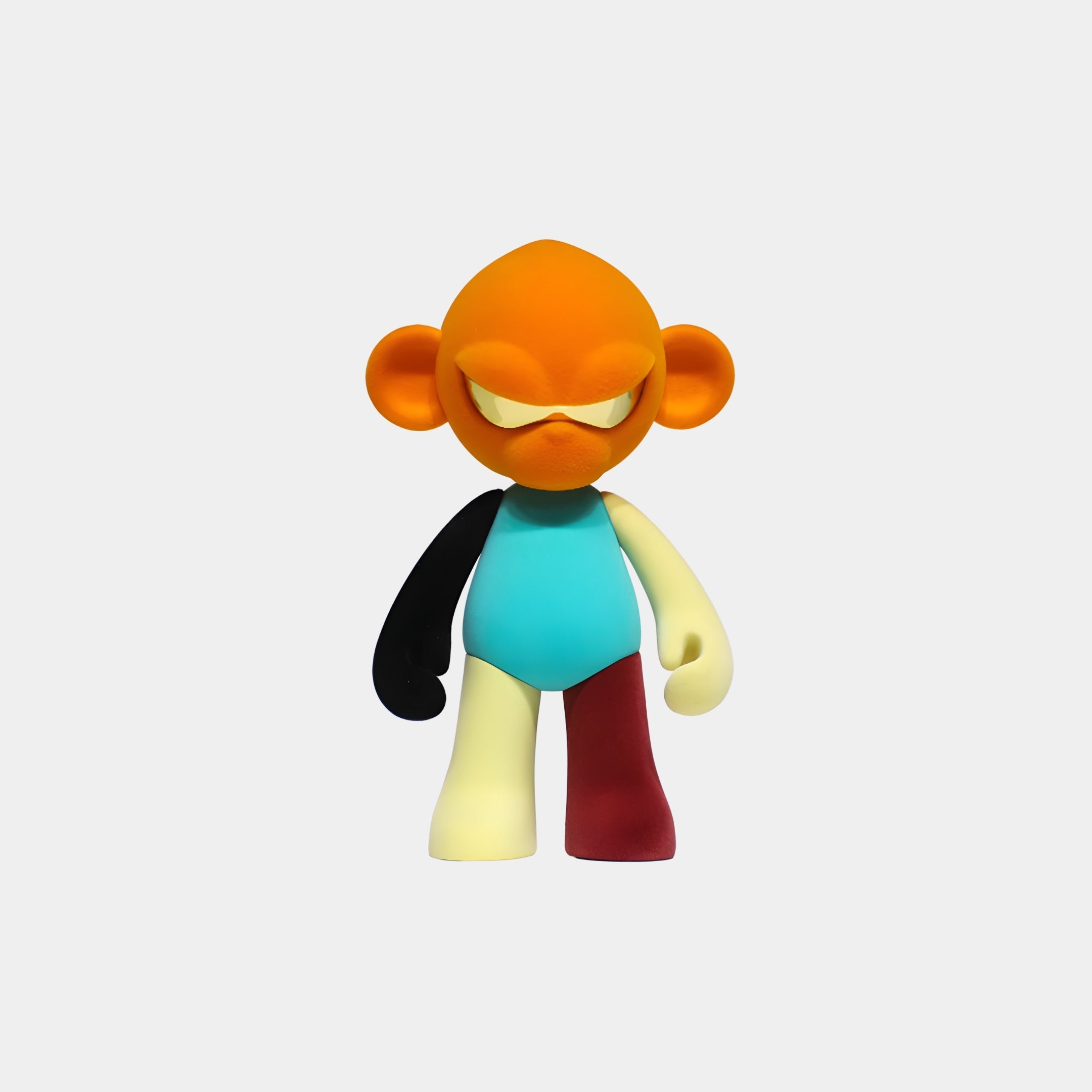 The Giant Sculptures Orange Head II Colorblock Monkey Figure (15cm) is a collectible with an orange head and ears, yellow eyes, turquoise body, mismatched limbs, and displayed against a white background.