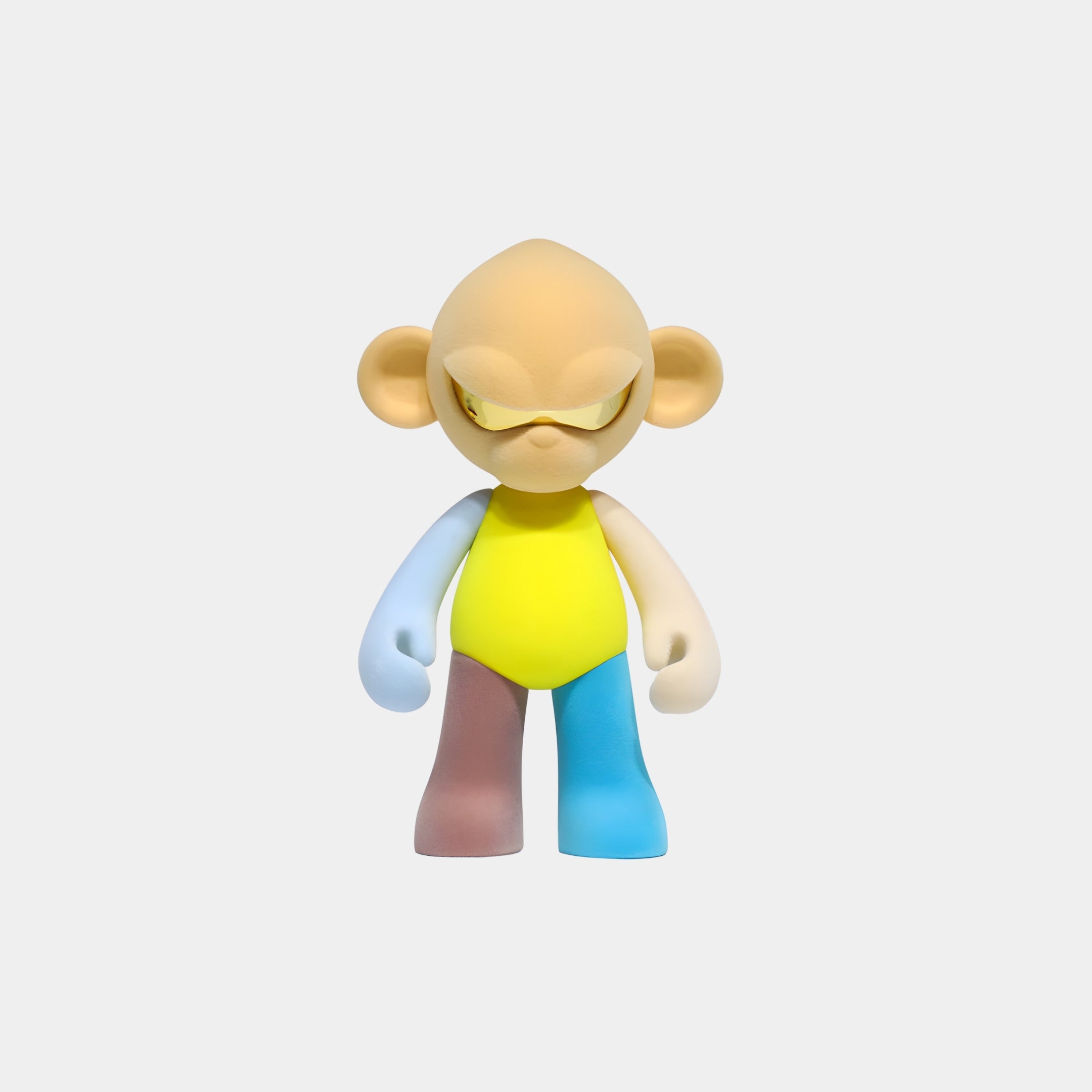 The Giant Sculptures Warm Beige Head II Colorblock Monkey Figure (15cm) features a stylized, cartoon-like design with a yellow body, mismatched limbs, large ears, and an unimpressed expression against a plain white background.
