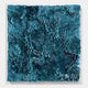 Auralith Teal Blue Layered Leather & Acrylic 3D Wall Art by Giant Sculptures, featuring swirling hand-shaped leather petals in deep teal, framed in a clear acrylic box on a white background.