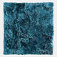 The Auralith Teal Blue Layered Leather 3D Wall Art by Giant Sculptures features overlapping teal and blue shapes reminiscent of petals or scales, forming a dense, textured swirl—an eye-catching piece for modern interiors.