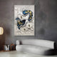 A modern living room with a curved light gray sofa, a round floor lamp, and Giant Sculptures’ Pearlash Coral Nest Mixed Media 3D Wall Art showcasing textured white, blue, and gold forms on a gray wall.