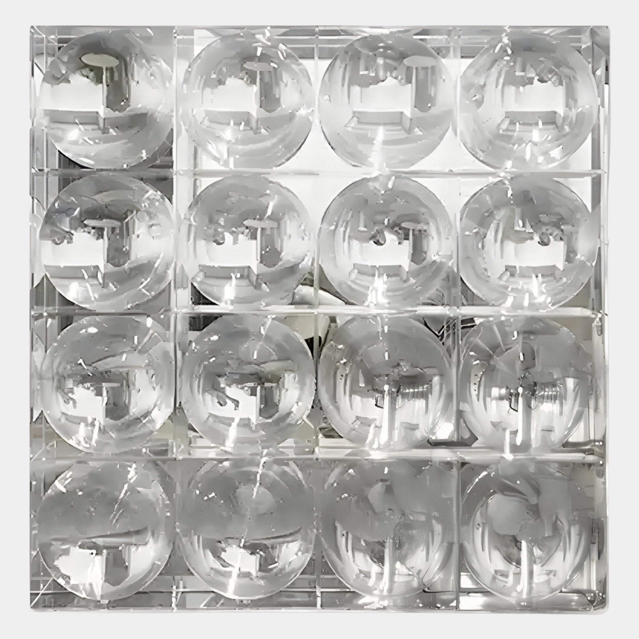 Top-down view of sixteen clear glasses in a dishwasher rack, their reflections evoke the bubble grid effect of Giant Sculptures Haloid II Bubble Grid Acrylic 3D Wall Art.