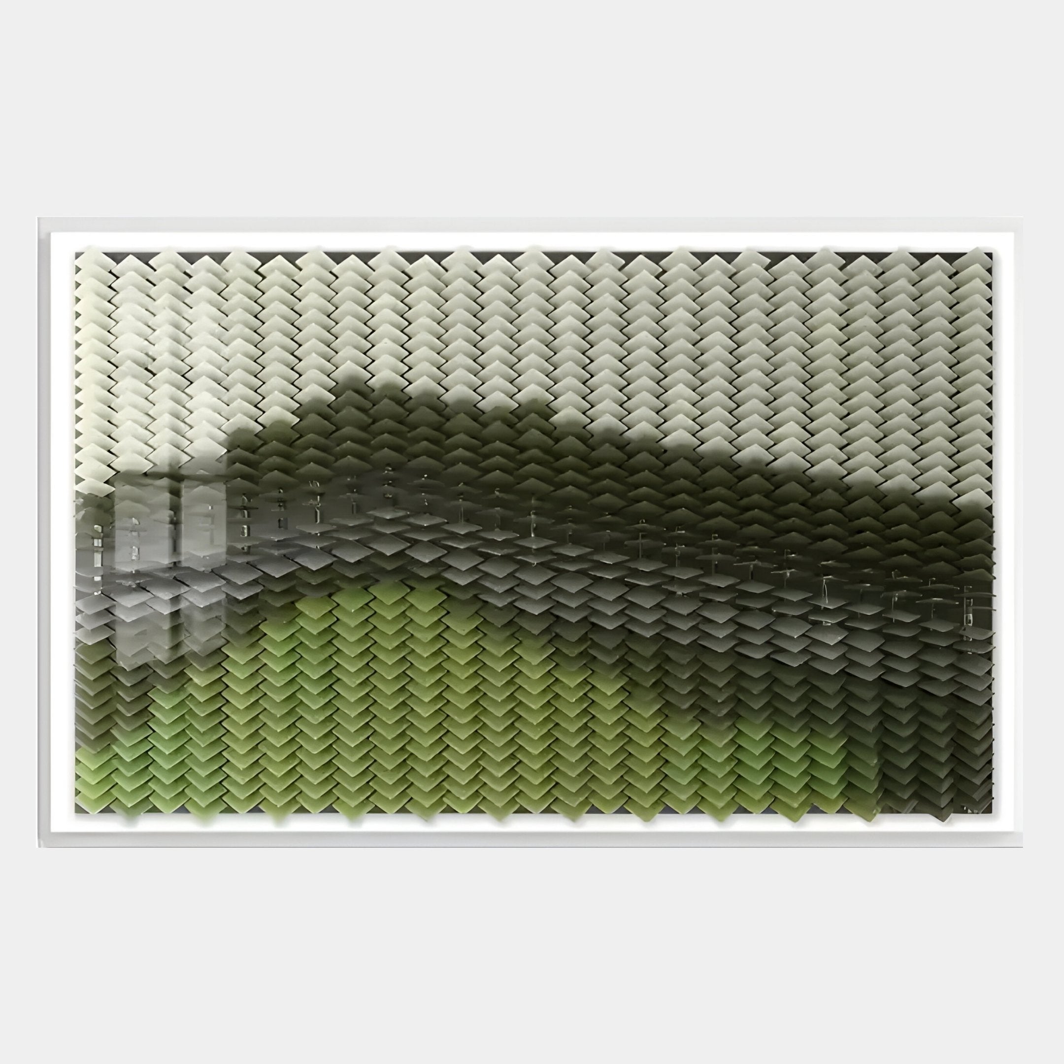 The Tessera Sage & Forest Green Gradient Acrylic 3D Wall Art by Giant Sculptures features chevron-shaped pieces in a grid, transitioning from white to green shades for a wave-like gradient effect.